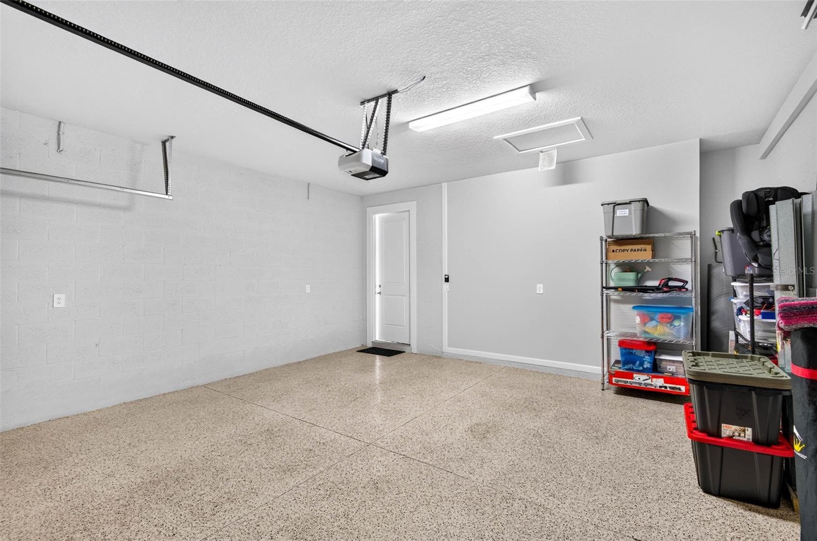 Durable Epoxy flooring in garage - 864 SNAIL KITE PL, SUN CITY CENTER
