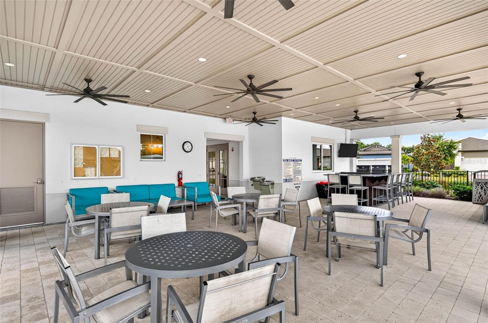 Expansive shaded sitting area with fans to keep you cool - 864 SNAIL KITE PL, SUN CITY CENTER