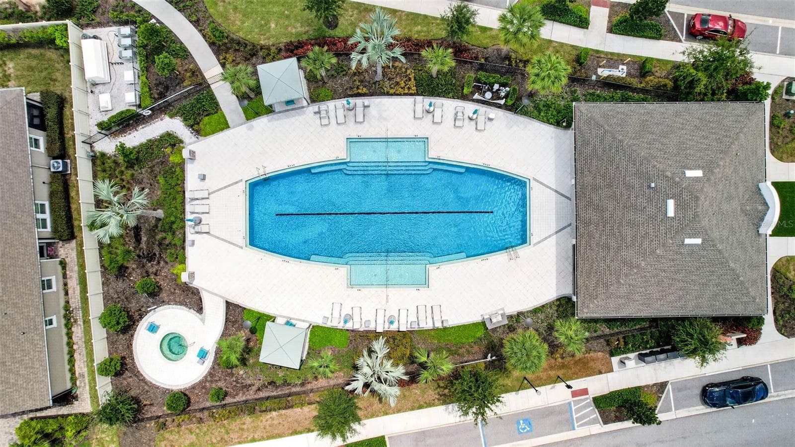 Community Pool surrounded by lush landscaping - 864 SNAIL KITE PL, SUN CITY CENTER