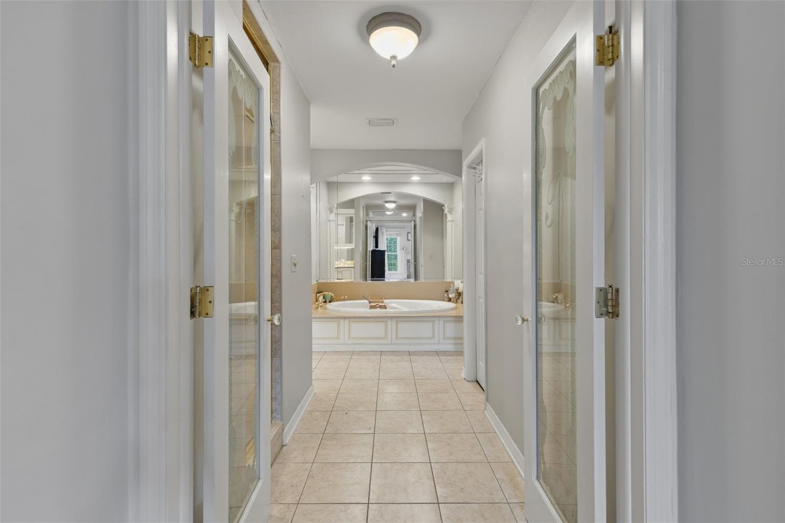 The double glass door entrance to the Primary Ensuite. - 4603 DOGWOOD HILLS CT, BRANDON