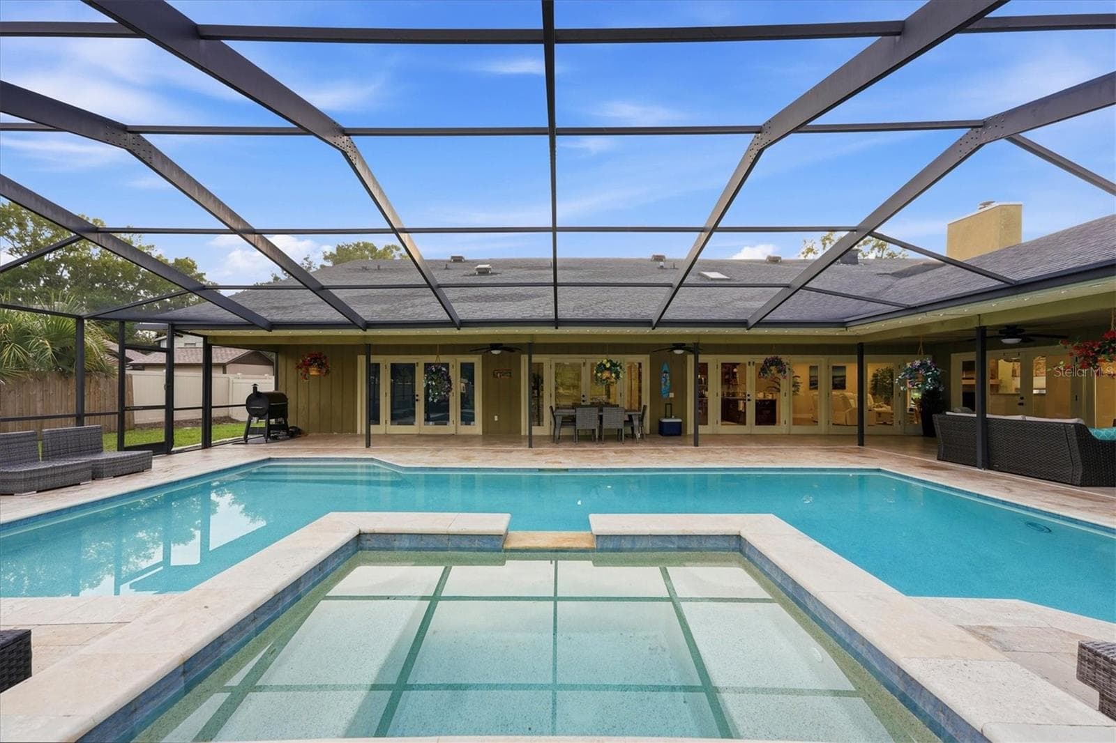 View from spa overlooking pool and patio - 15127 PENNINGTON RD, TAMPA
