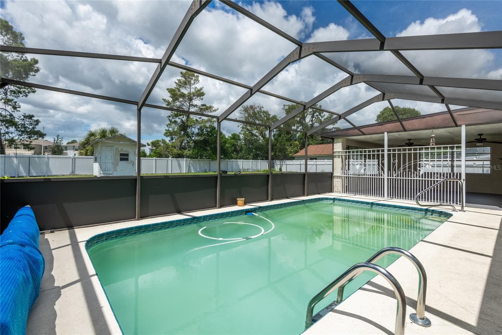 Pool is screened in. Pool was cloudy on day of photos with all the recent rain. Seller will be correcting situation. - 1257 FINLAND DR, SPRING HILL