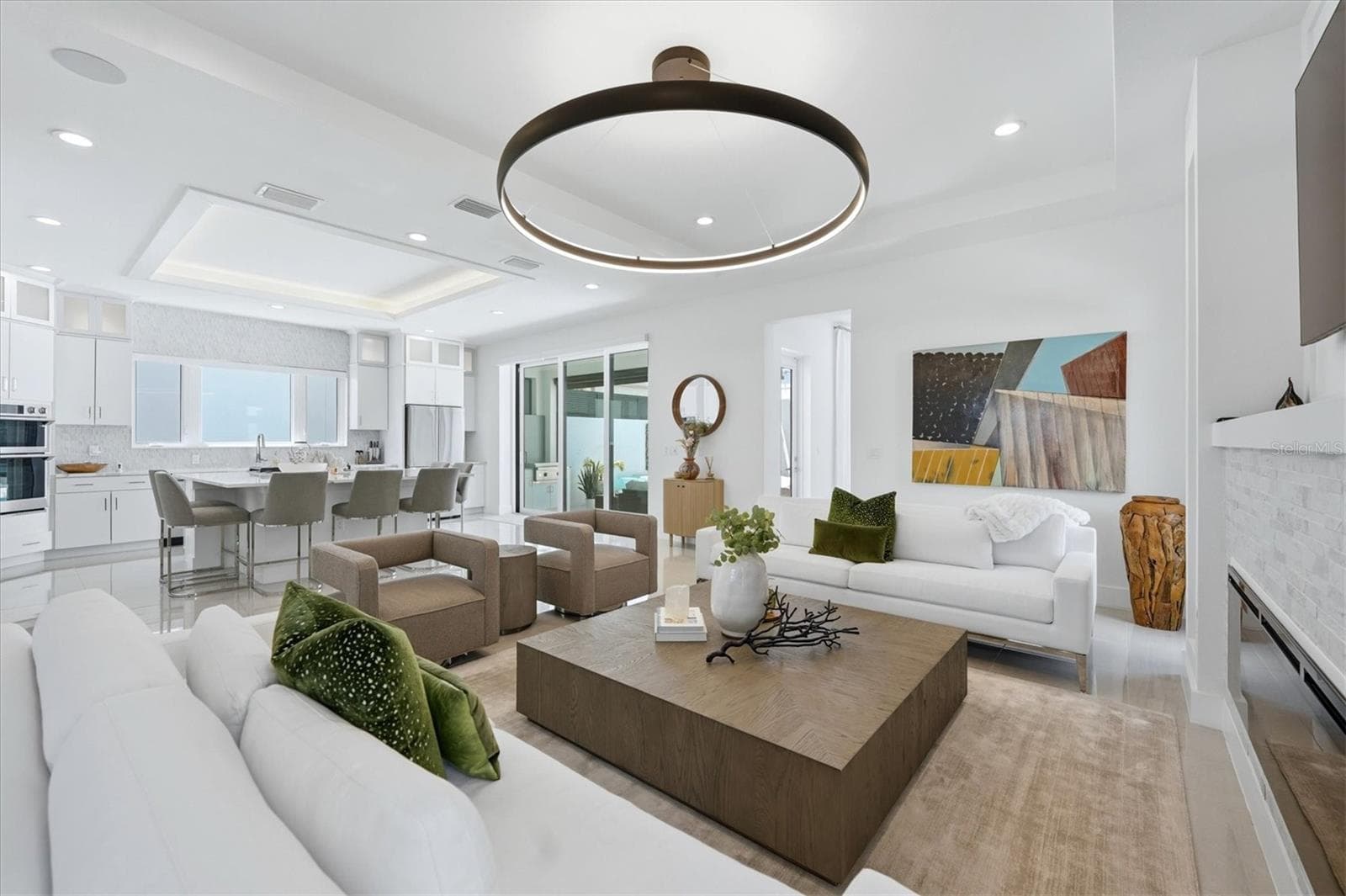 open plan from kitchen to family room - 5935 REDBAY BLVD, BRADENTON