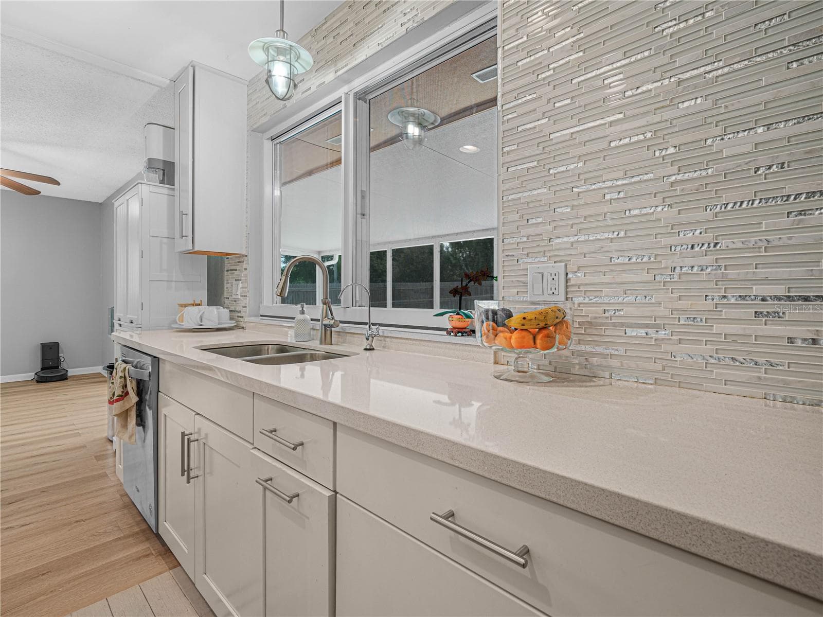 updated kitchen with pass-through window for easy access to patio guests - 437 BROWARD TER, WINTER HAVEN