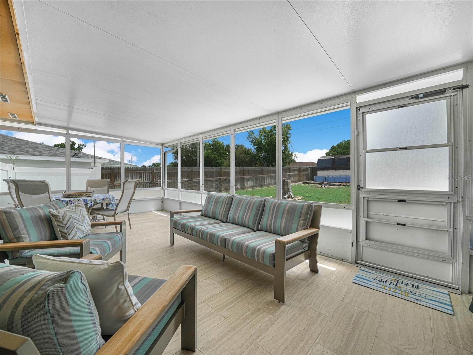 Large tiled screened-in patio - 437 BROWARD TER, WINTER HAVEN