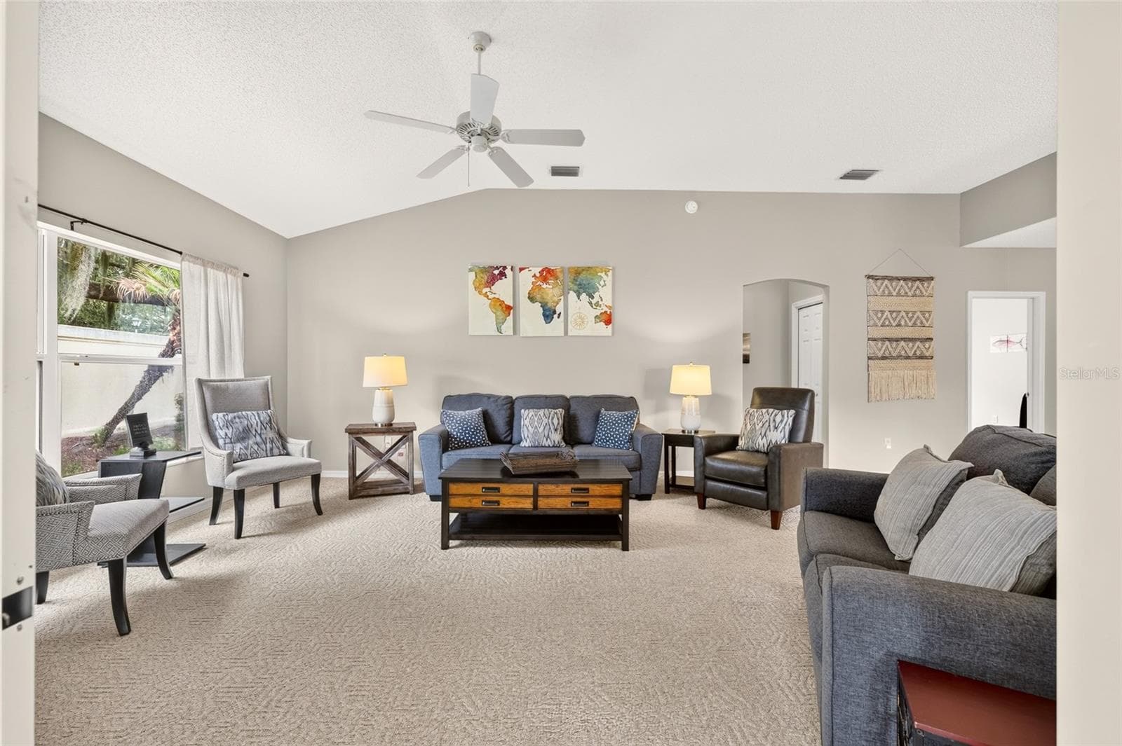 Living room captured from the patio doors to the enclosed lanai! - 17198 SE 84TH KNIGHT AVE, THE VILLAGES