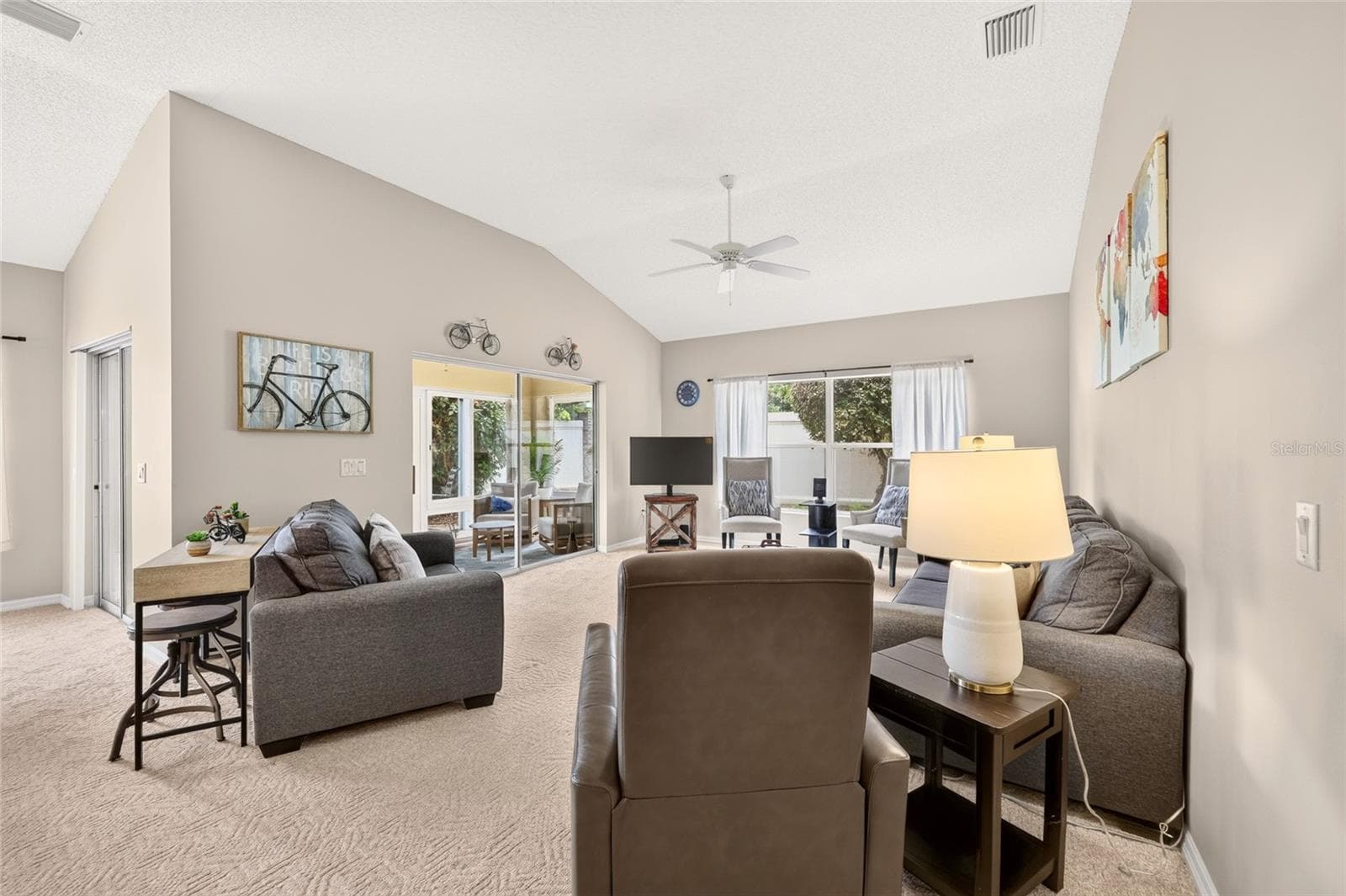 Looking into the living room with lots of seating for entertaining! - 17198 SE 84TH KNIGHT AVE, THE VILLAGES