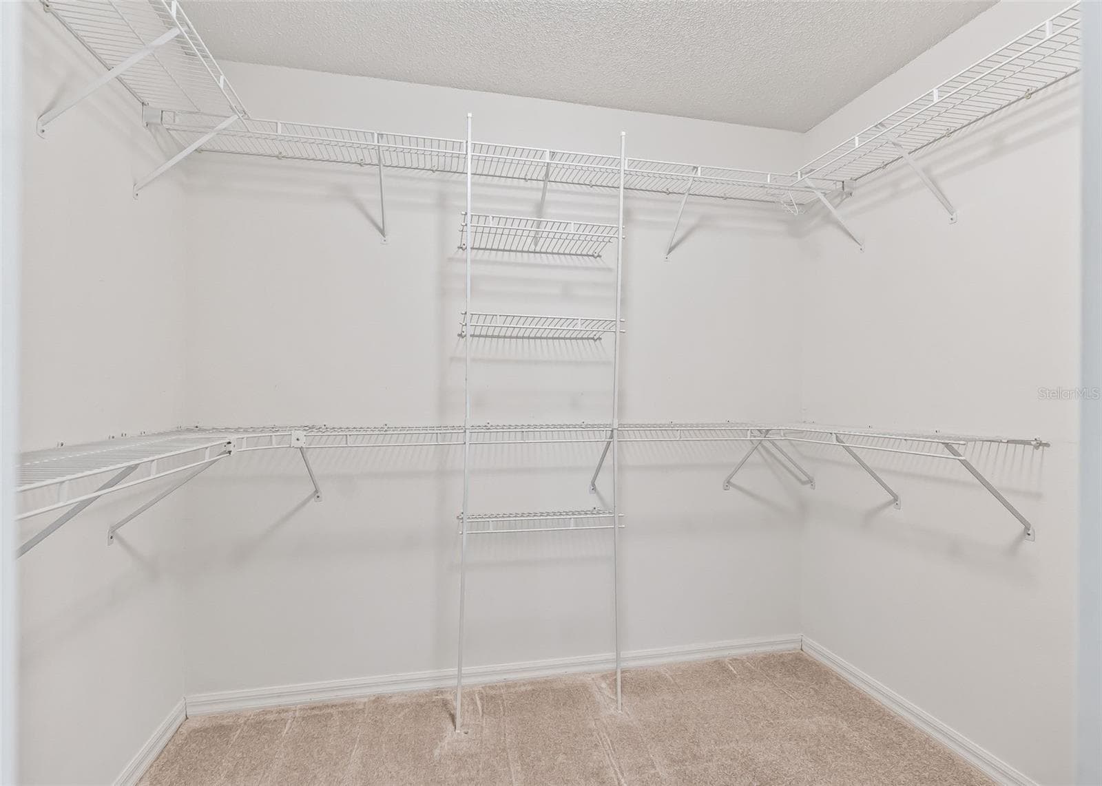 Spacious Primary walk-in closet - 1506 AQUINO LN, THE VILLAGES