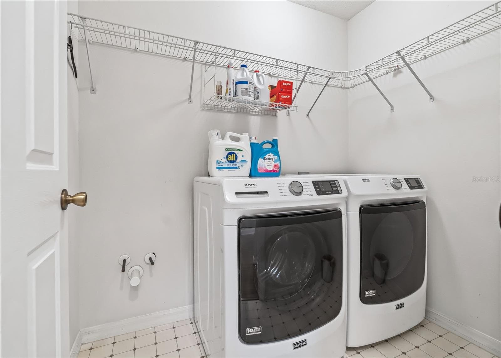 Laundry Room in hallway off Primary Bedroom - 1506 AQUINO LN, THE VILLAGES