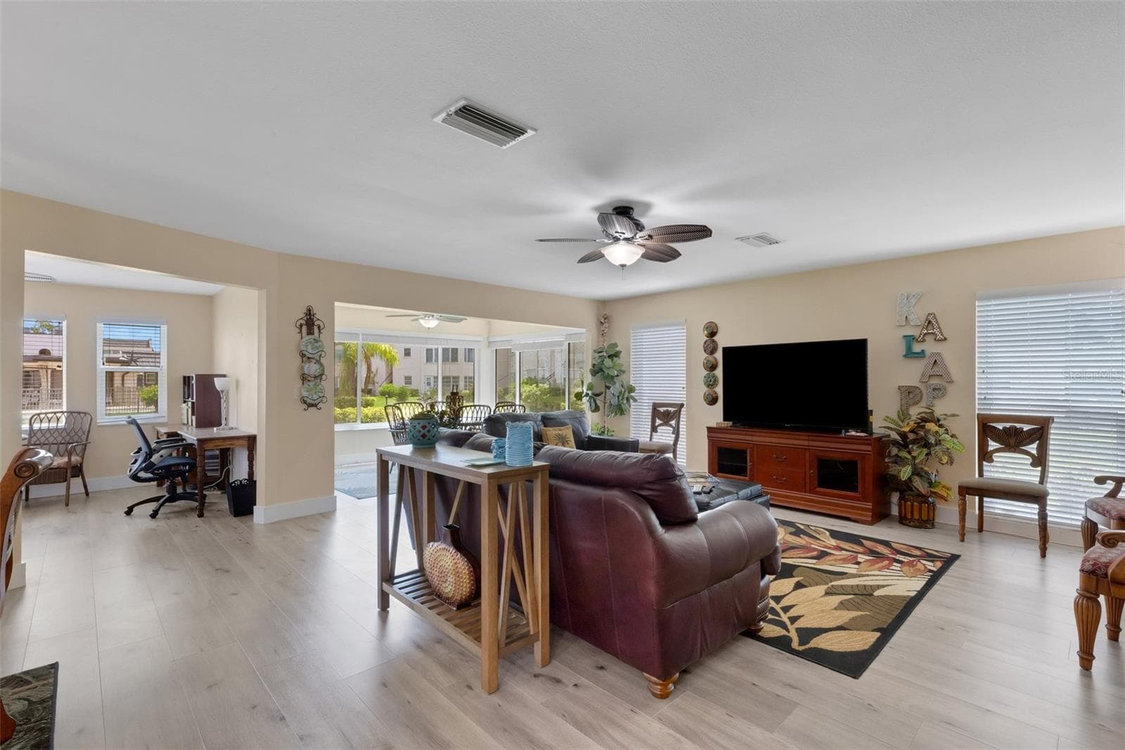 Living Room with Florida Room and 3rd Bedroom/Home Office on Left - 112 ELMWOOD CIR #112, SEMINOLE