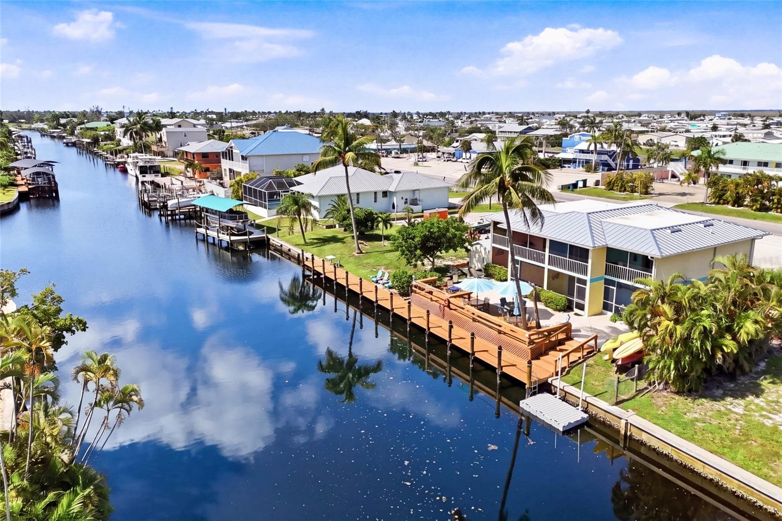 An impressive full-length waterfront dock provides exceptional boating access and plenty of space to enjoy everything Southwest Florida waterfront living has to offer. - 3226 STRINGFELLOW RD, ST JAMES CITY