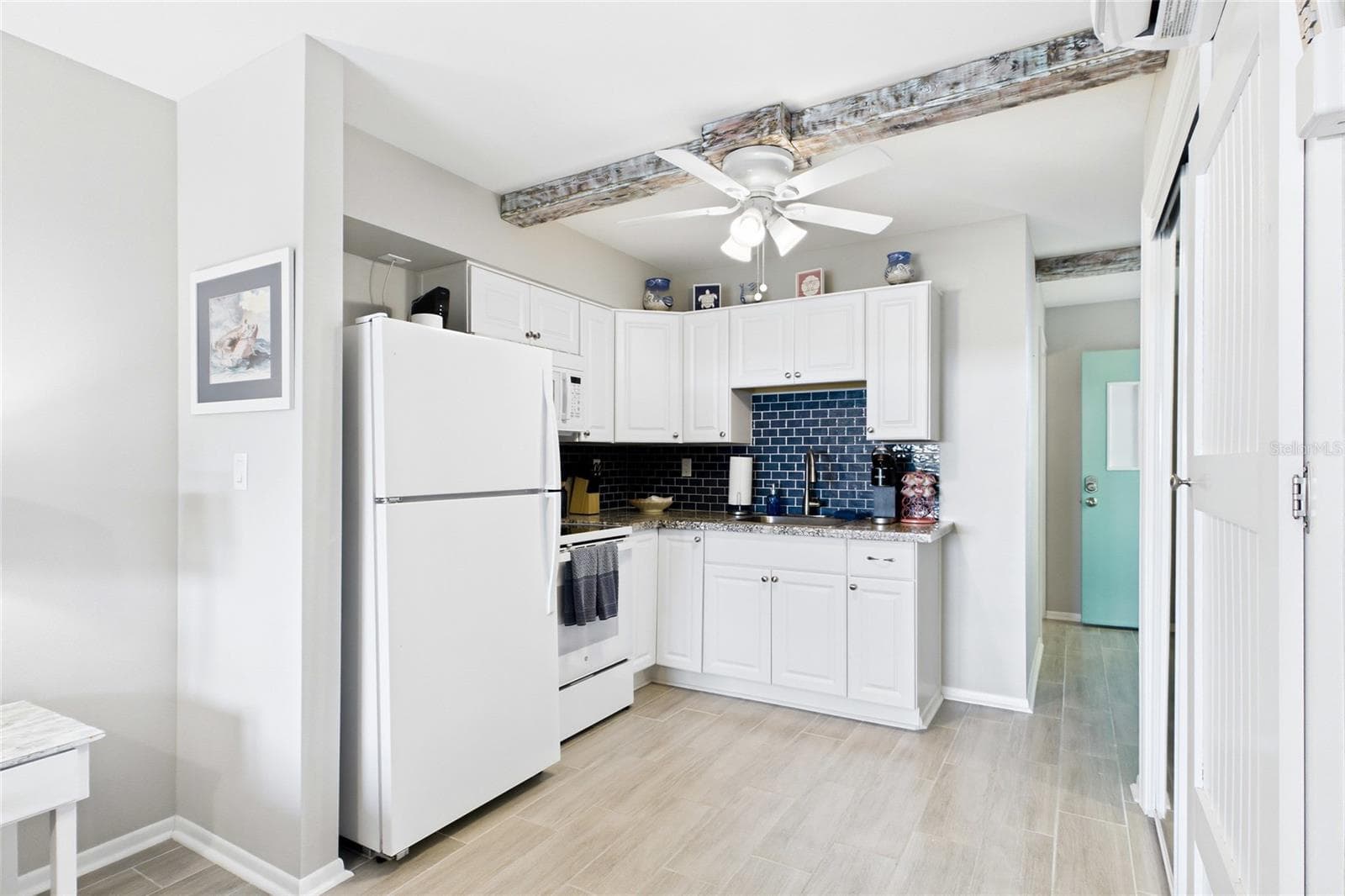 THE ISLAND ROOM Updated kitchens provide guests with the convenience of preparing meals while enjoying the comfort and privacy of their own waterfront retreat. - 3226 STRINGFELLOW RD, ST JAMES CITY