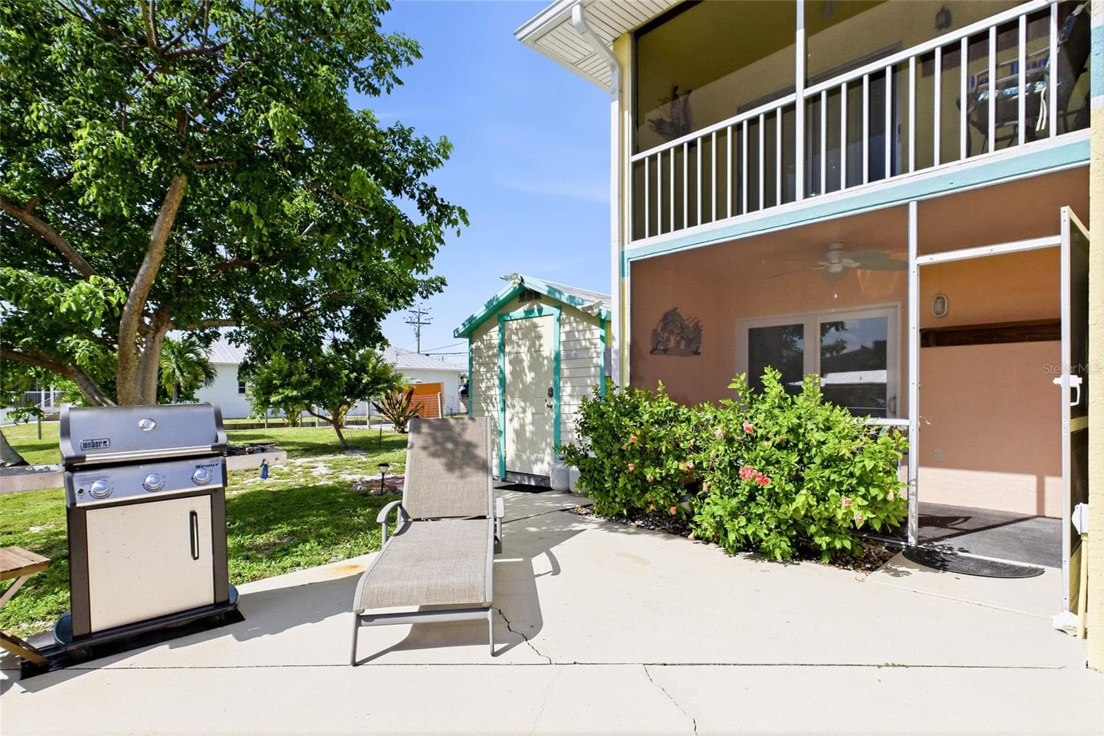 Inviting guest BBQ area ideal for outdoor dining, entertaining, and enjoying warm island evenings. - 3226 STRINGFELLOW RD, ST JAMES CITY