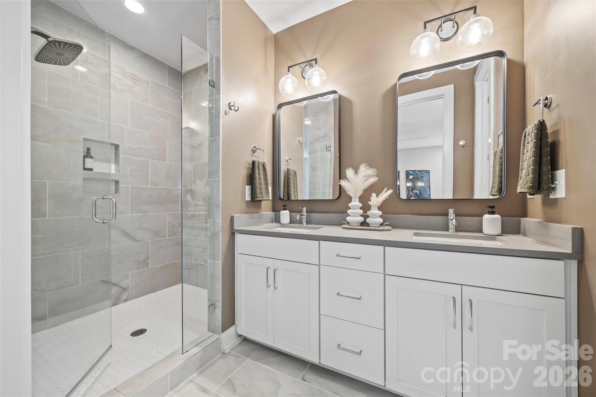 Primary bath with dual vanities and tiled walk-in shower - 4017 Plaza Row Court, Charlotte