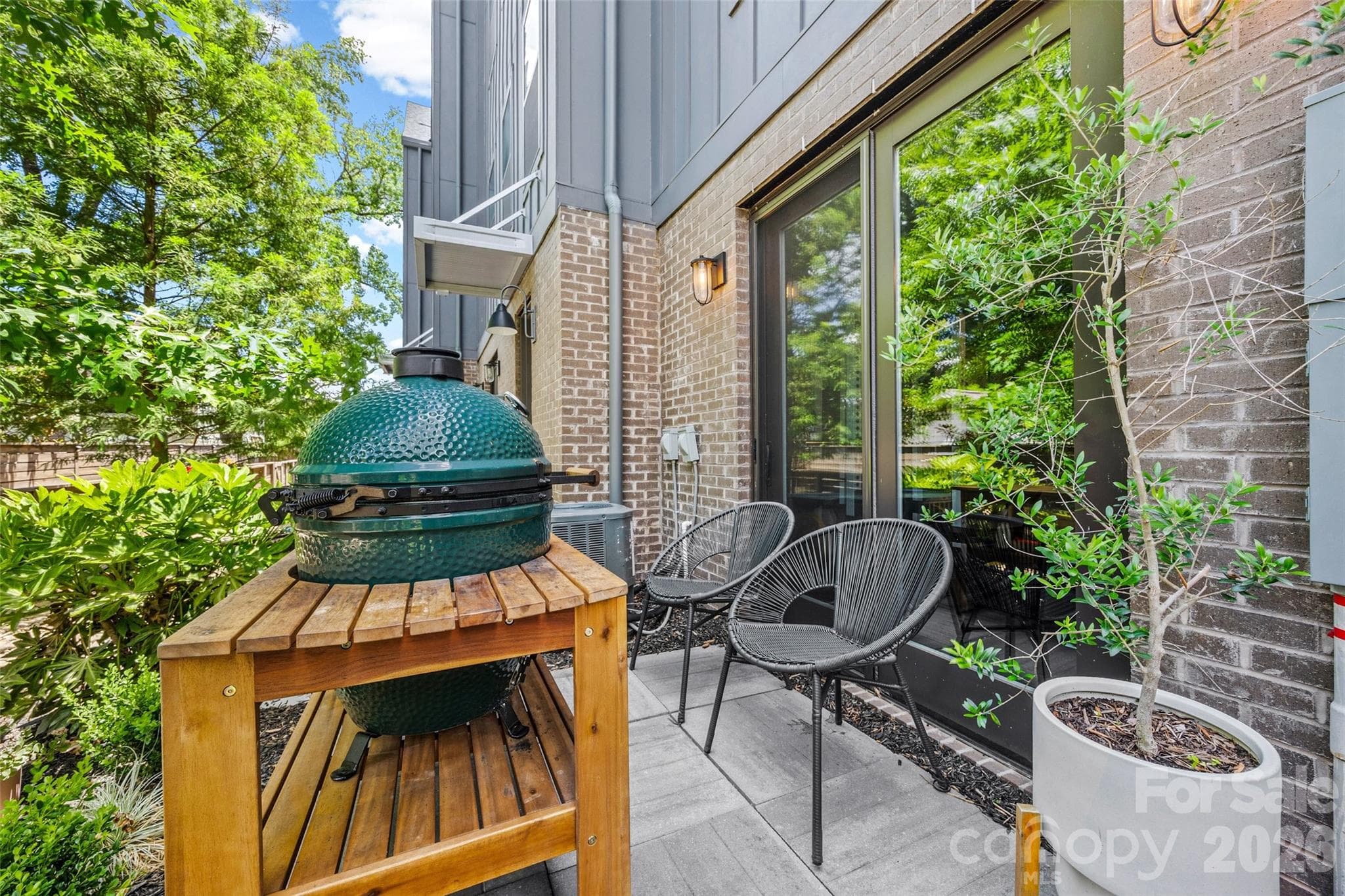 Private patio tucked along the landscaped courtyard - 4017 Plaza Row Court, Charlotte