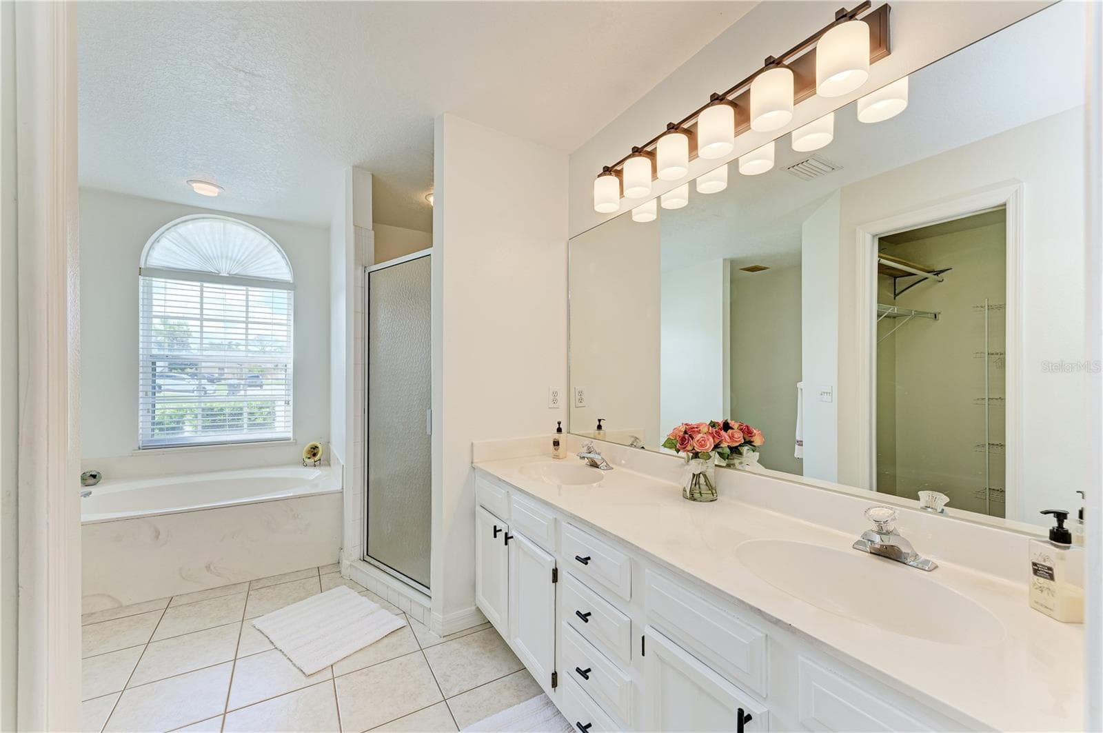 Tranquil Primary Bathroom with dual sinks, garden tub and separate shower - 3213 45TH AVE E, BRADENTON