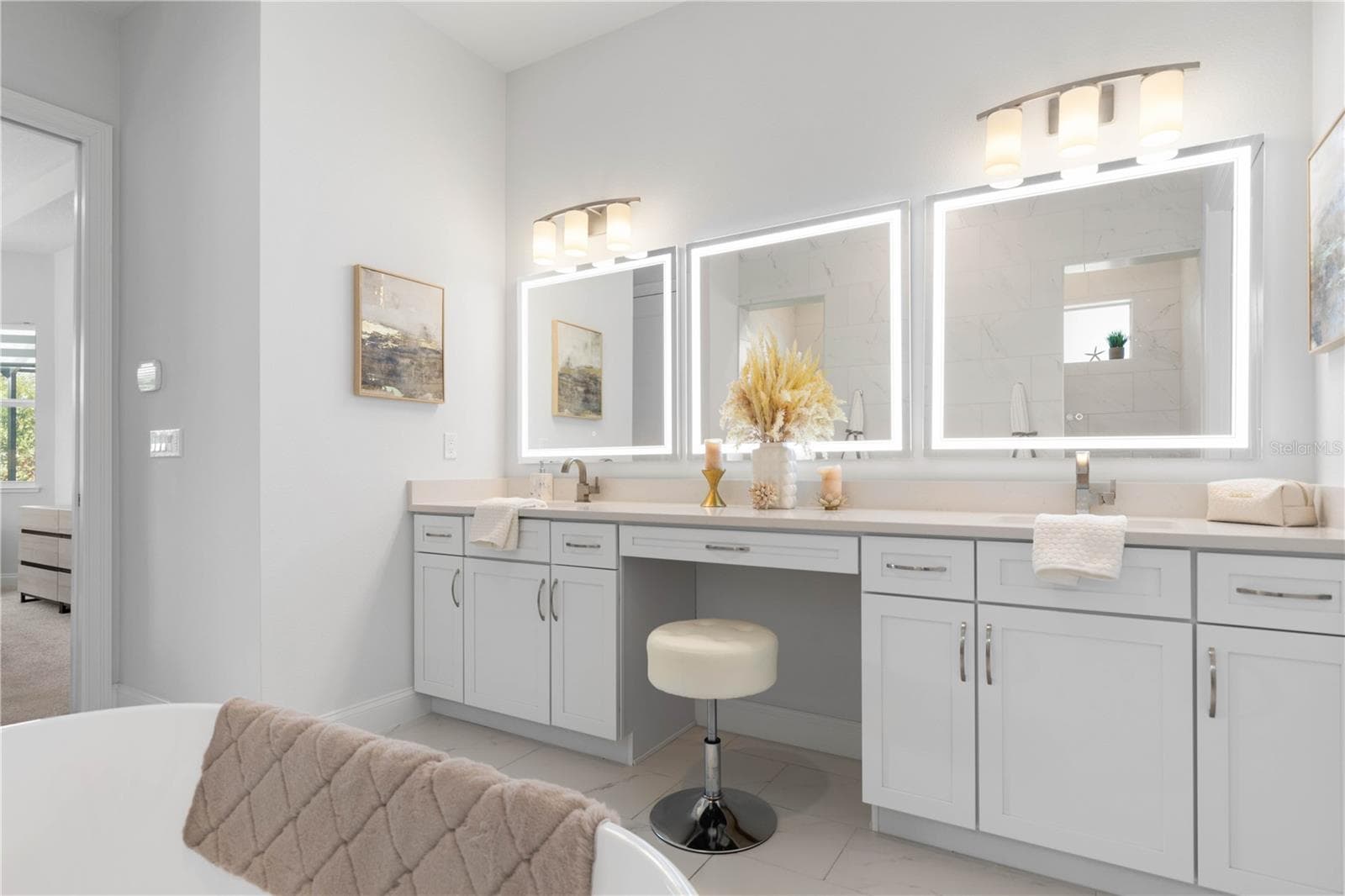 Dual vanities with sitting area and LED mirrors - 23 OCEAN RIDGE BLVD N, PALM COAST