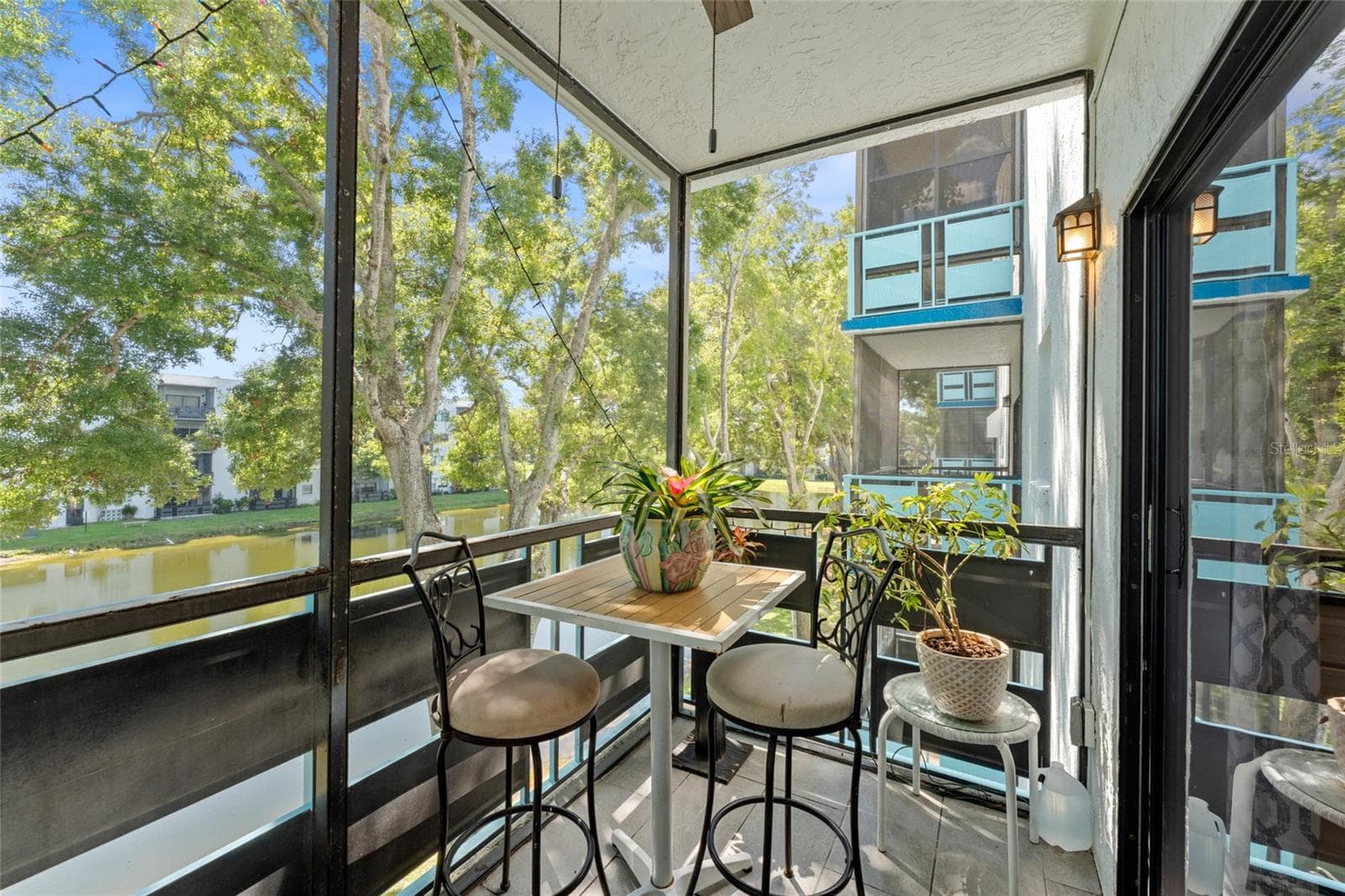 Your screened lanai has an eastern exposure for morning sun,you are in the perfect location in the building to enjoy the pond views with the soothing fountain - 5970 80TH ST N #309, ST PETERSBURG