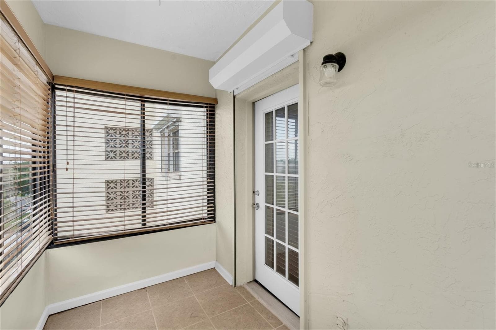 Enclosed patio off of the primary bedroom - 8198 TERRACE GARDEN DR #511, ST PETERSBURG