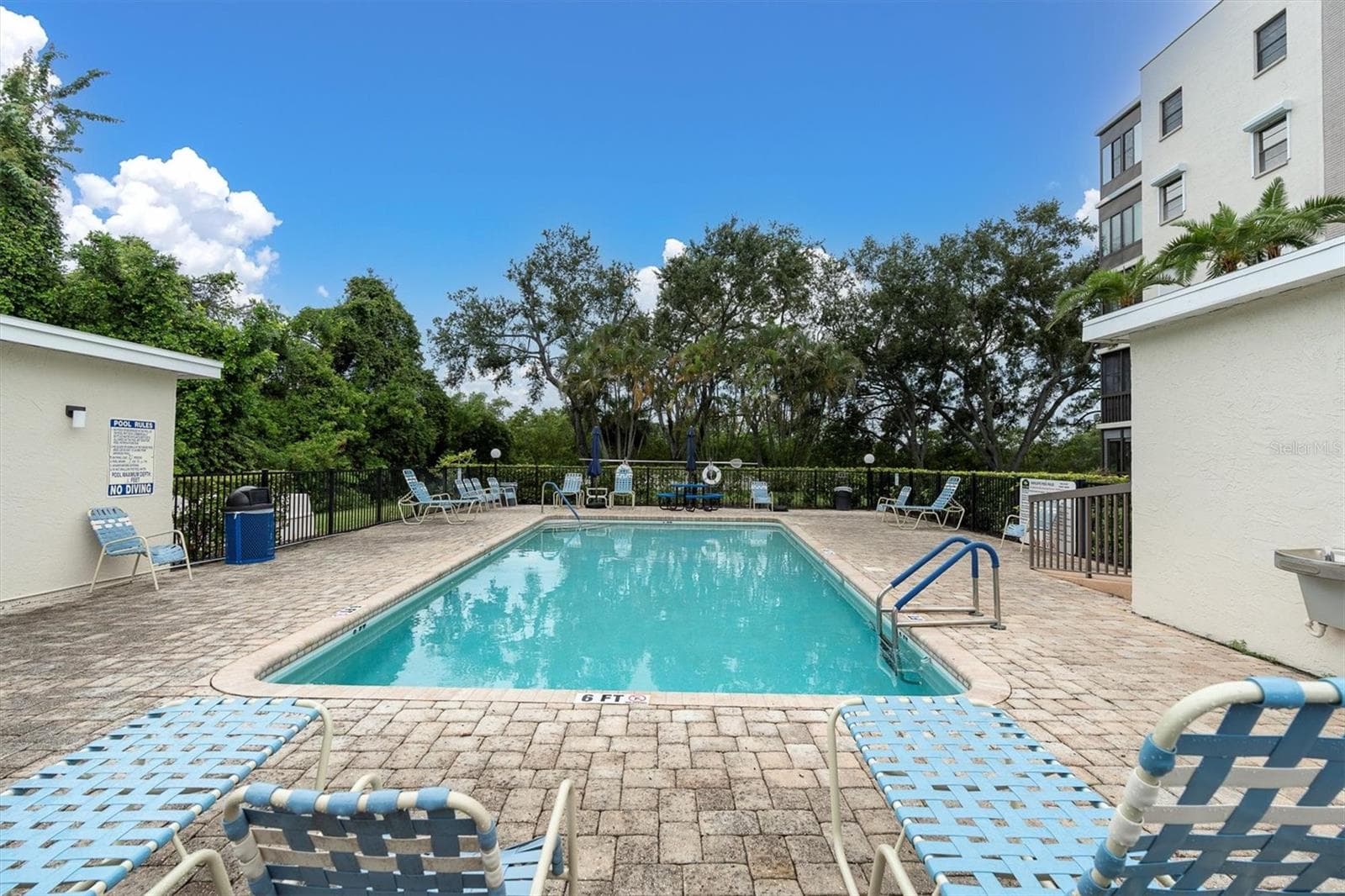 Resident pool located directly next to the building - 8198 TERRACE GARDEN DR #511, ST PETERSBURG