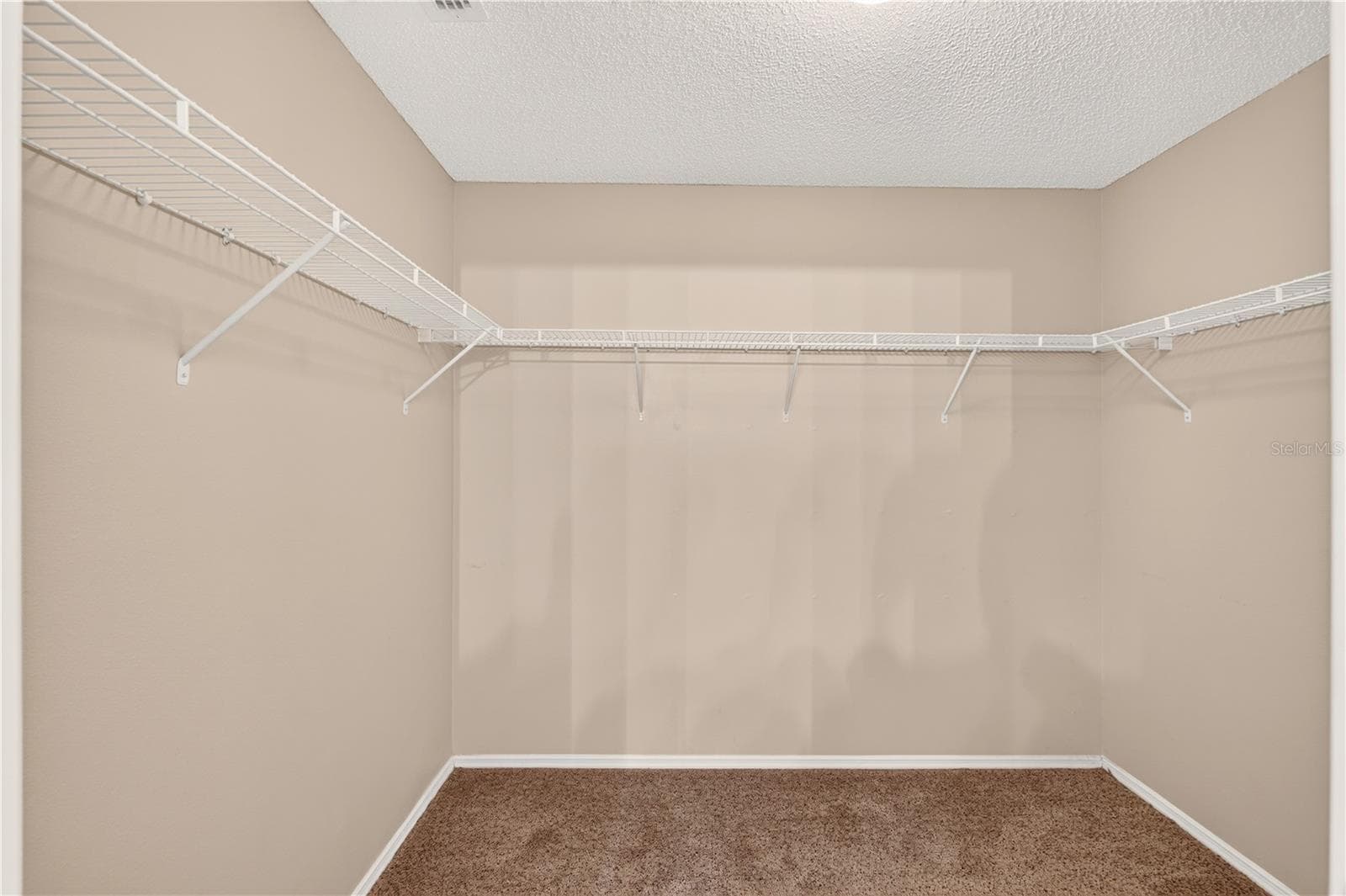 You will love the walk in closet in the primary suite. - 8214 SE 169TH PALOWNIA LOOP, THE VILLAGES