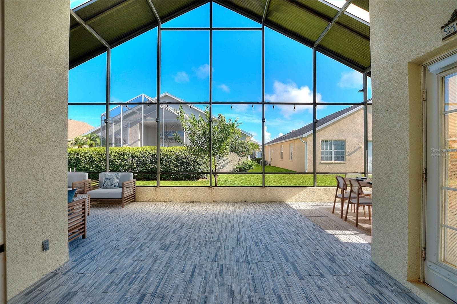 Virtually staged lanai - 140 MOSS LN, DAVENPORT