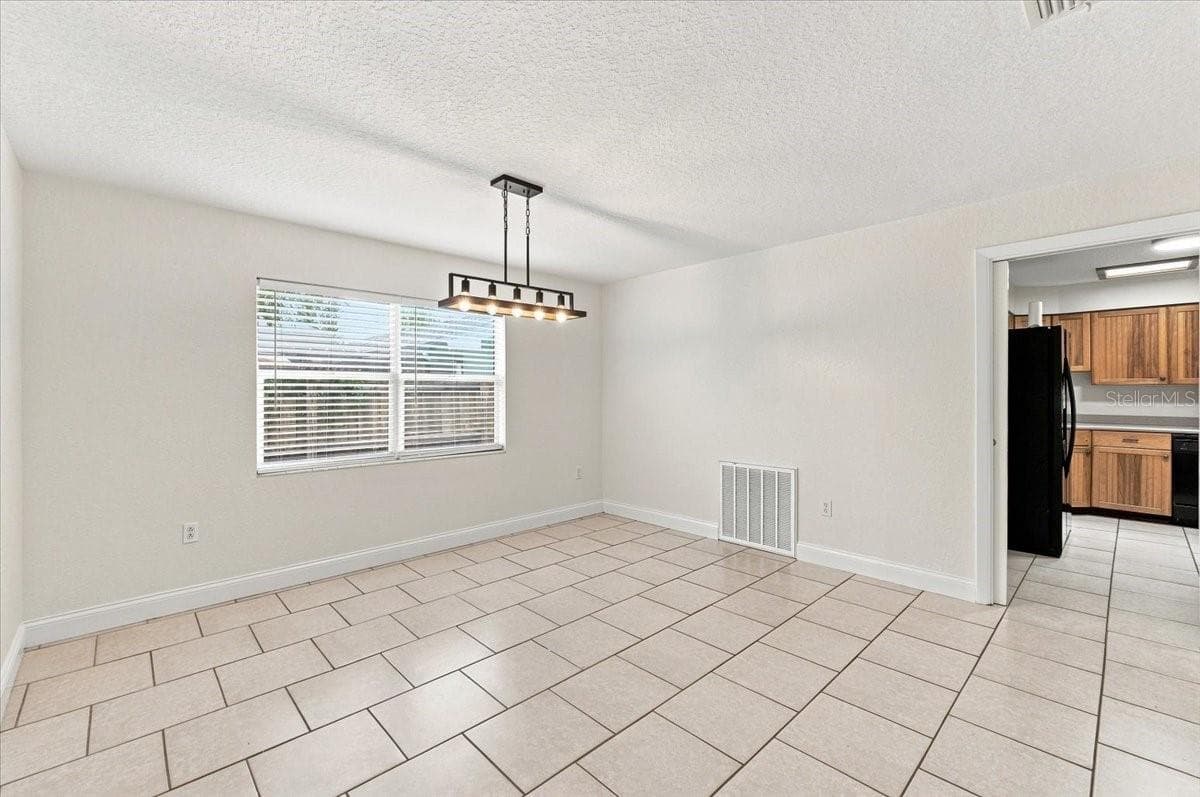Dining room with entry to kitchen - 121 LOWELL RD, WINTER HAVEN