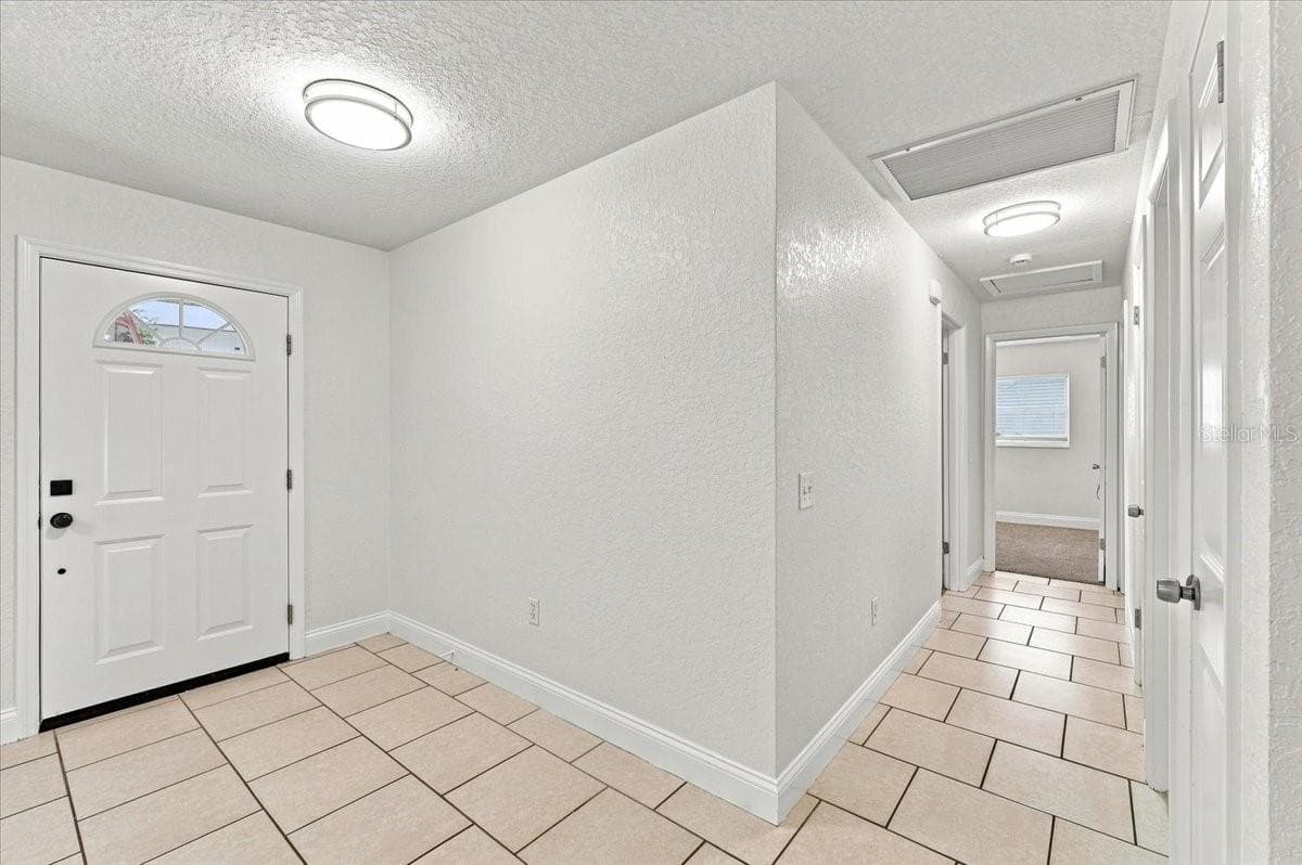 Front door with hallway - 121 LOWELL RD, WINTER HAVEN