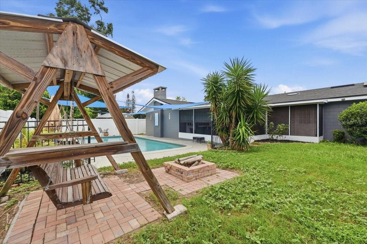 Back yard with firepit and pool - 121 LOWELL RD, WINTER HAVEN