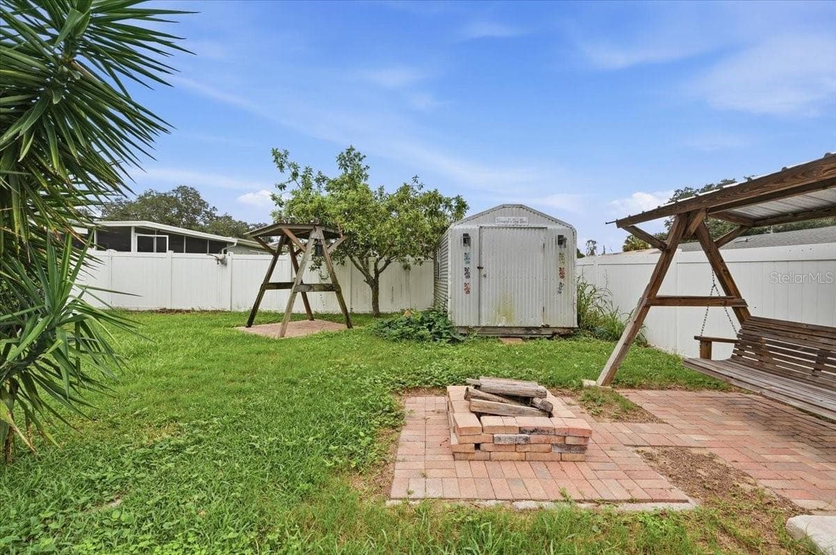 Back yard with shed and firepit - 121 LOWELL RD, WINTER HAVEN