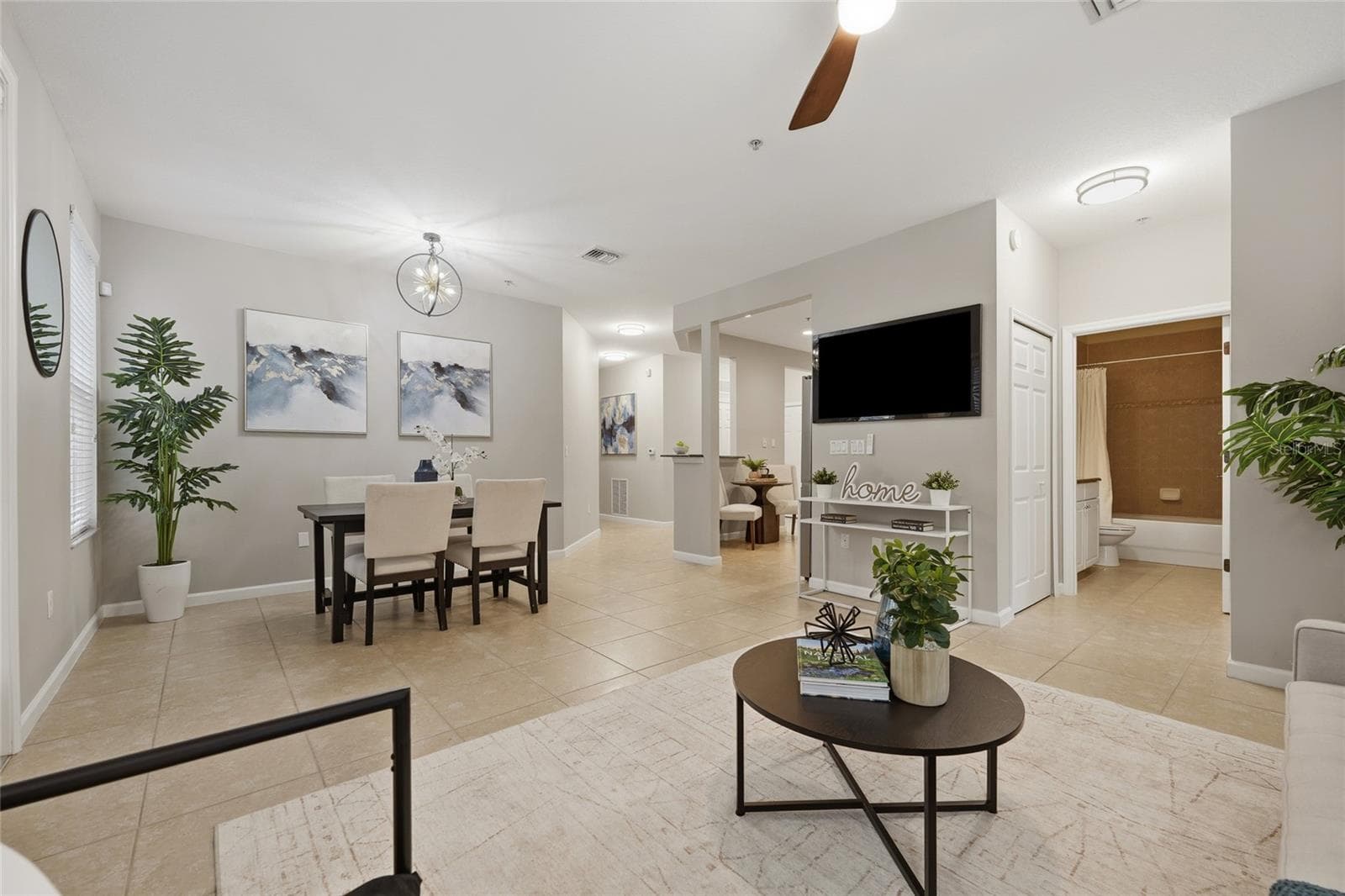 Open-concept living and dining areas create an easy, connected layout ideal for everyday living and entertaining. - 1674 LAKEMONT AVE #101, ORLANDO