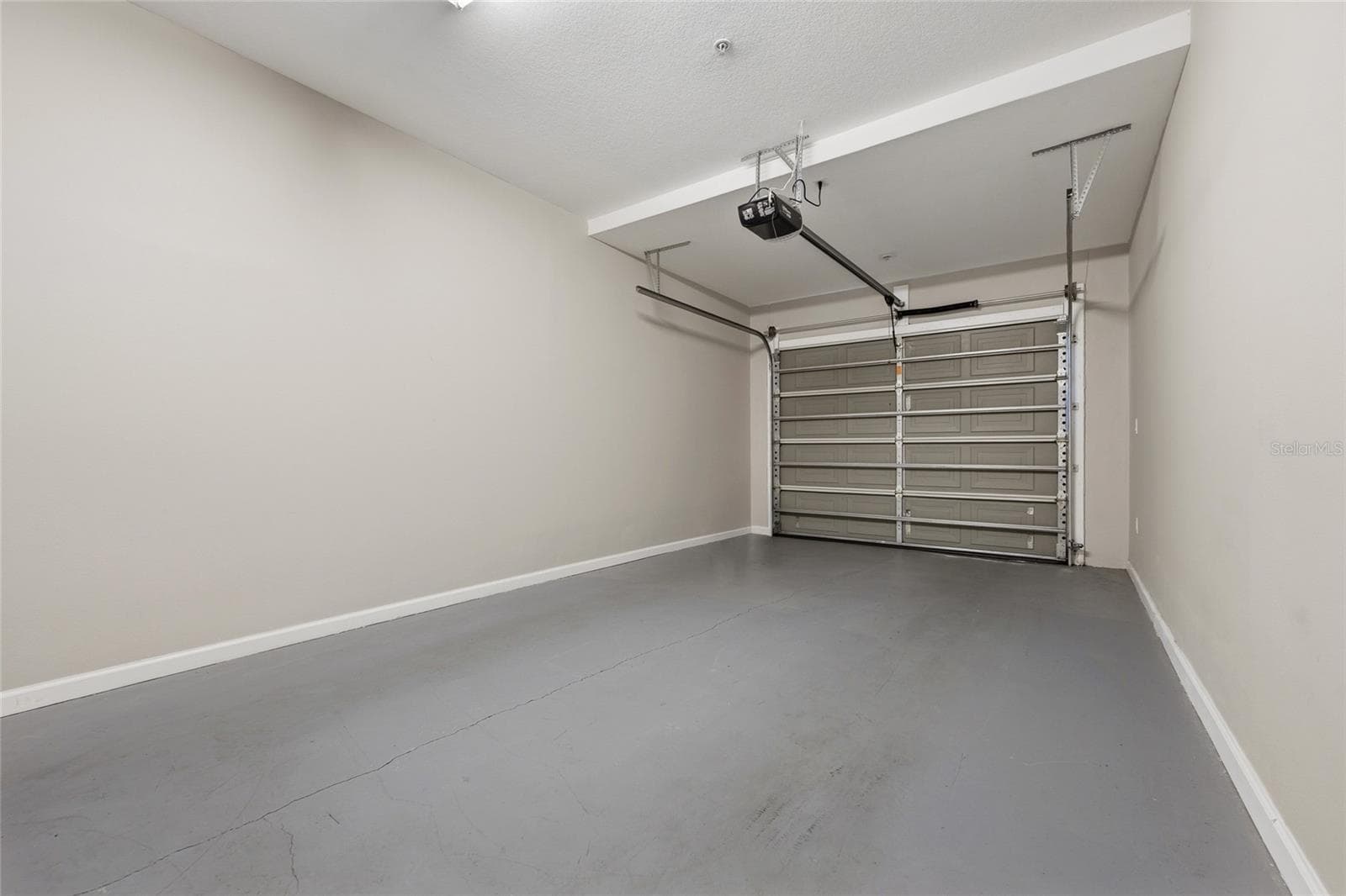 Private attached one-car garage provides secure parking and additional storage. - 1674 LAKEMONT AVE #101, ORLANDO