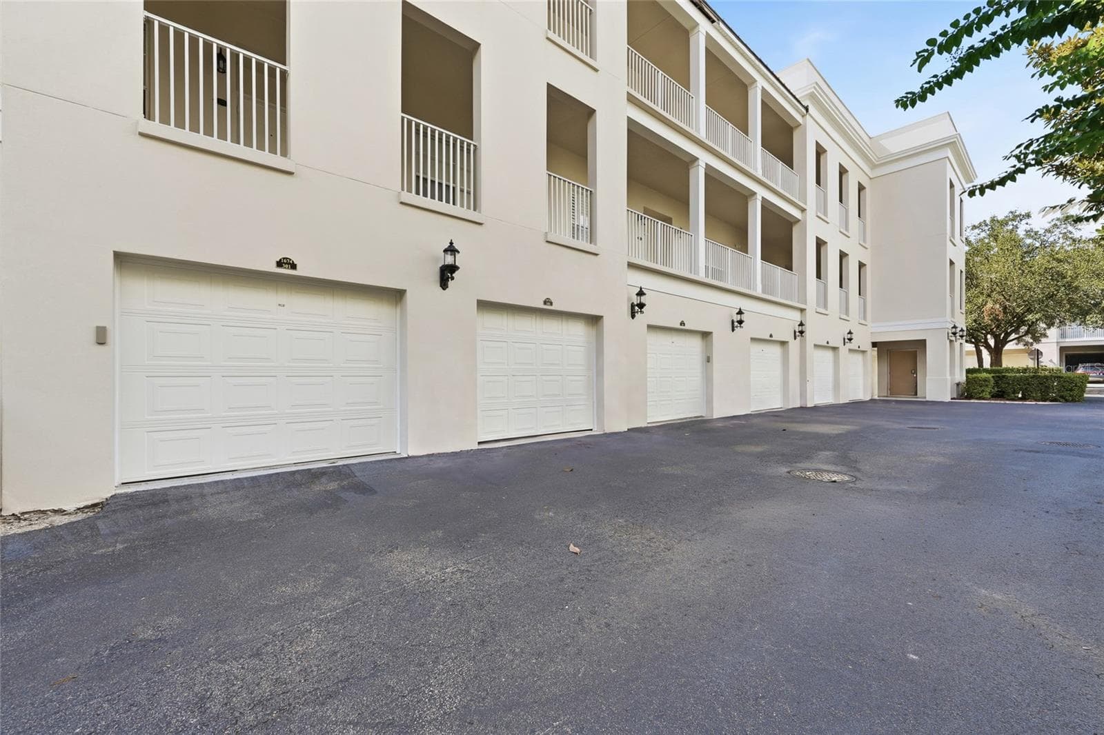 Rear view of the residence and private garage access. - 1674 LAKEMONT AVE #101, ORLANDO