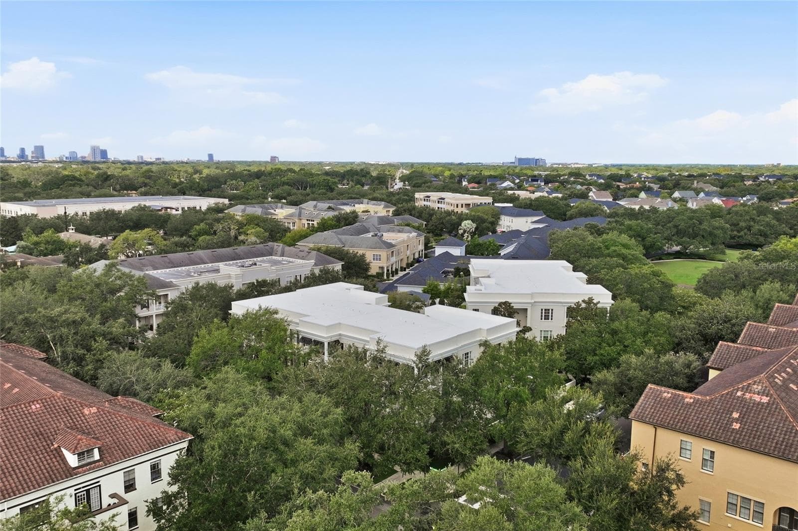 Aerial view showcasing Baldwin Park’s beautiful tree-lined neighborhood and proximity to Downtown Orlando. - 1674 LAKEMONT AVE #101, ORLANDO