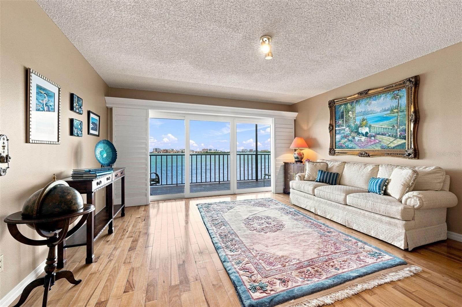 Formal Living Room with sliders to one of two balconies - 55 ROGERS ST #204, CLEARWATER