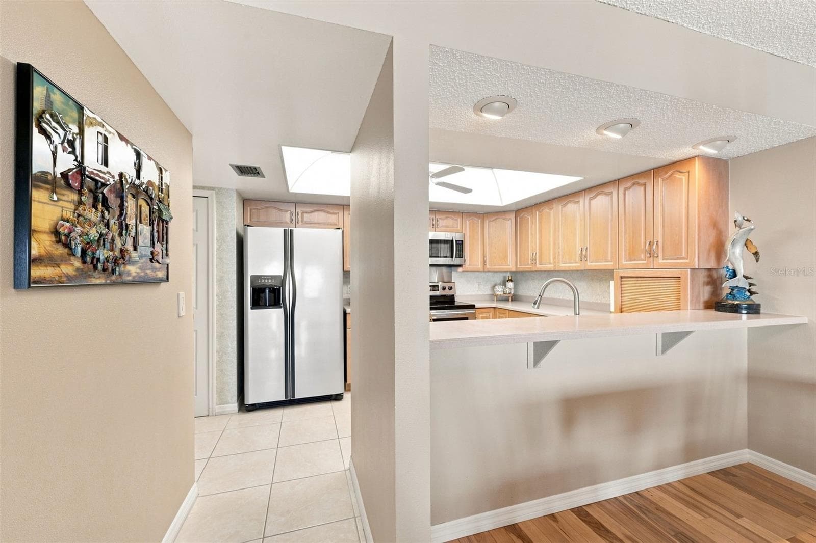 Kitchen with large walk-in pantry - 55 ROGERS ST #204, CLEARWATER