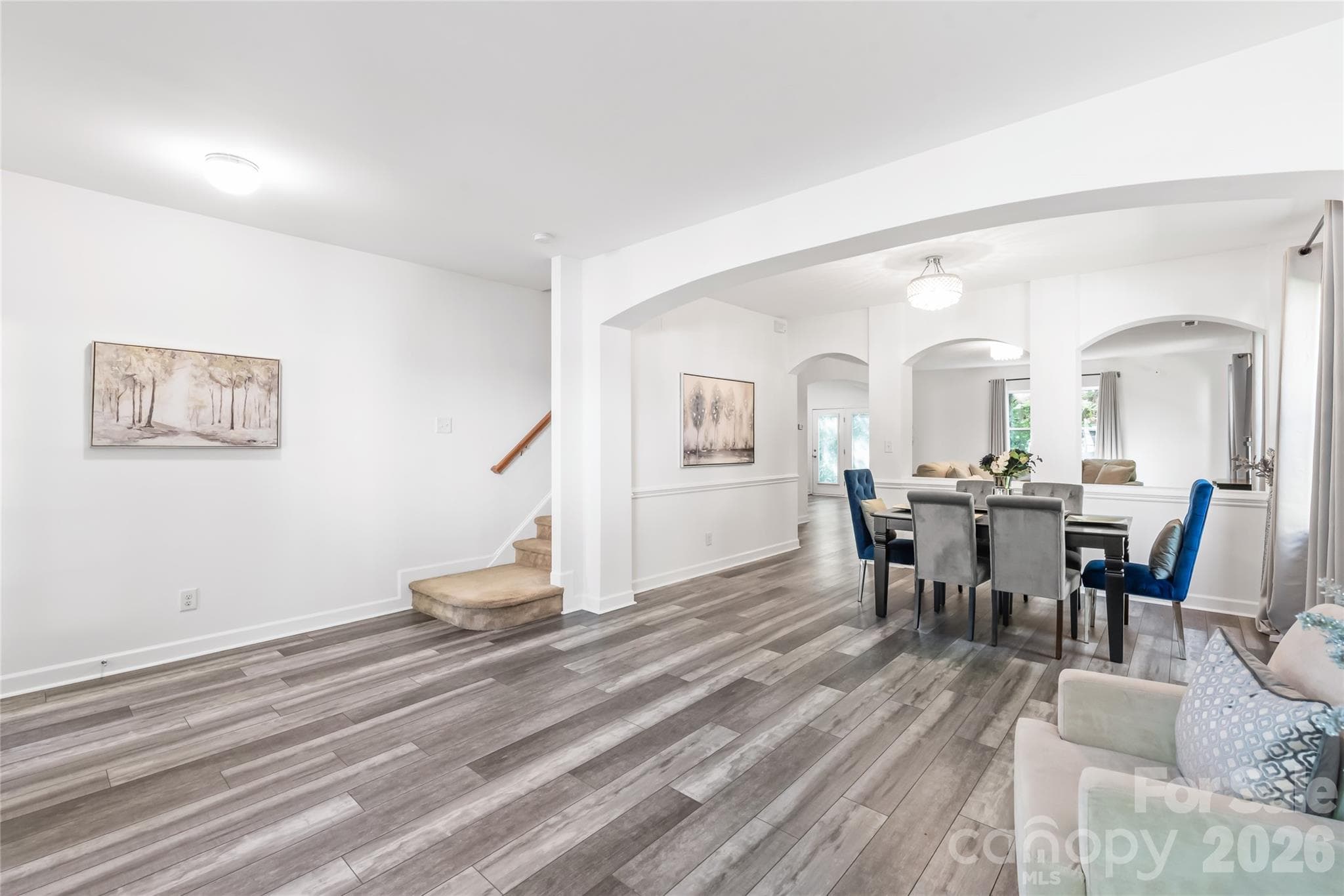 "Open-concept living and dining space with tons of natural light and a great flow." - 6404 Lanzerac Manor Drive, Charlotte
