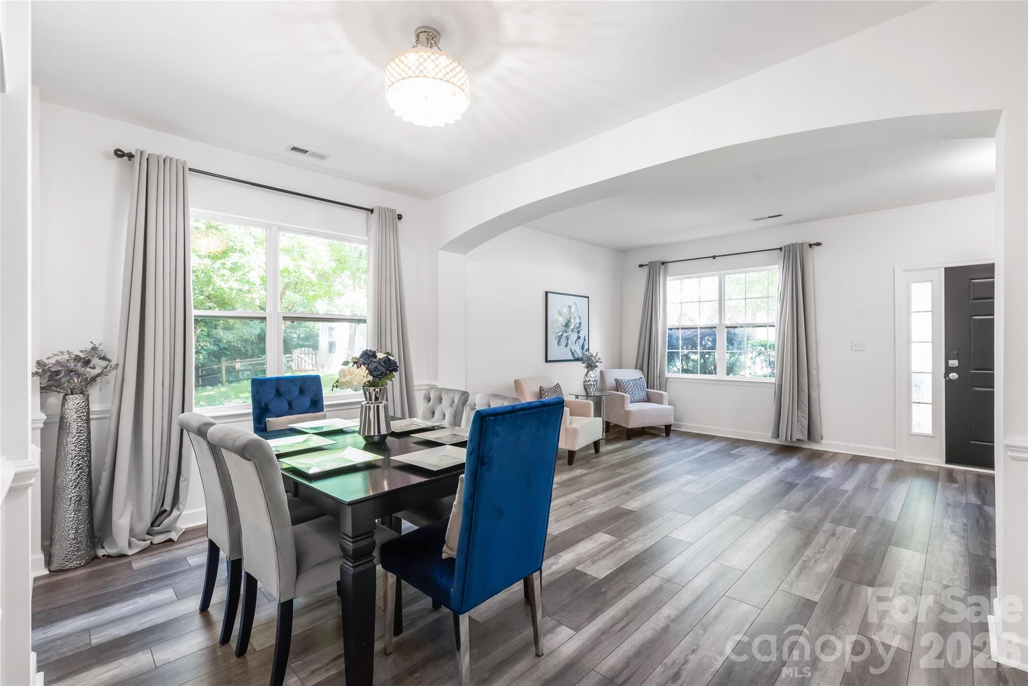 "Spacious dining area featuring an open layout, abundant natural light, and sophisticated interior detailing." - 6404 Lanzerac Manor Drive, Charlotte