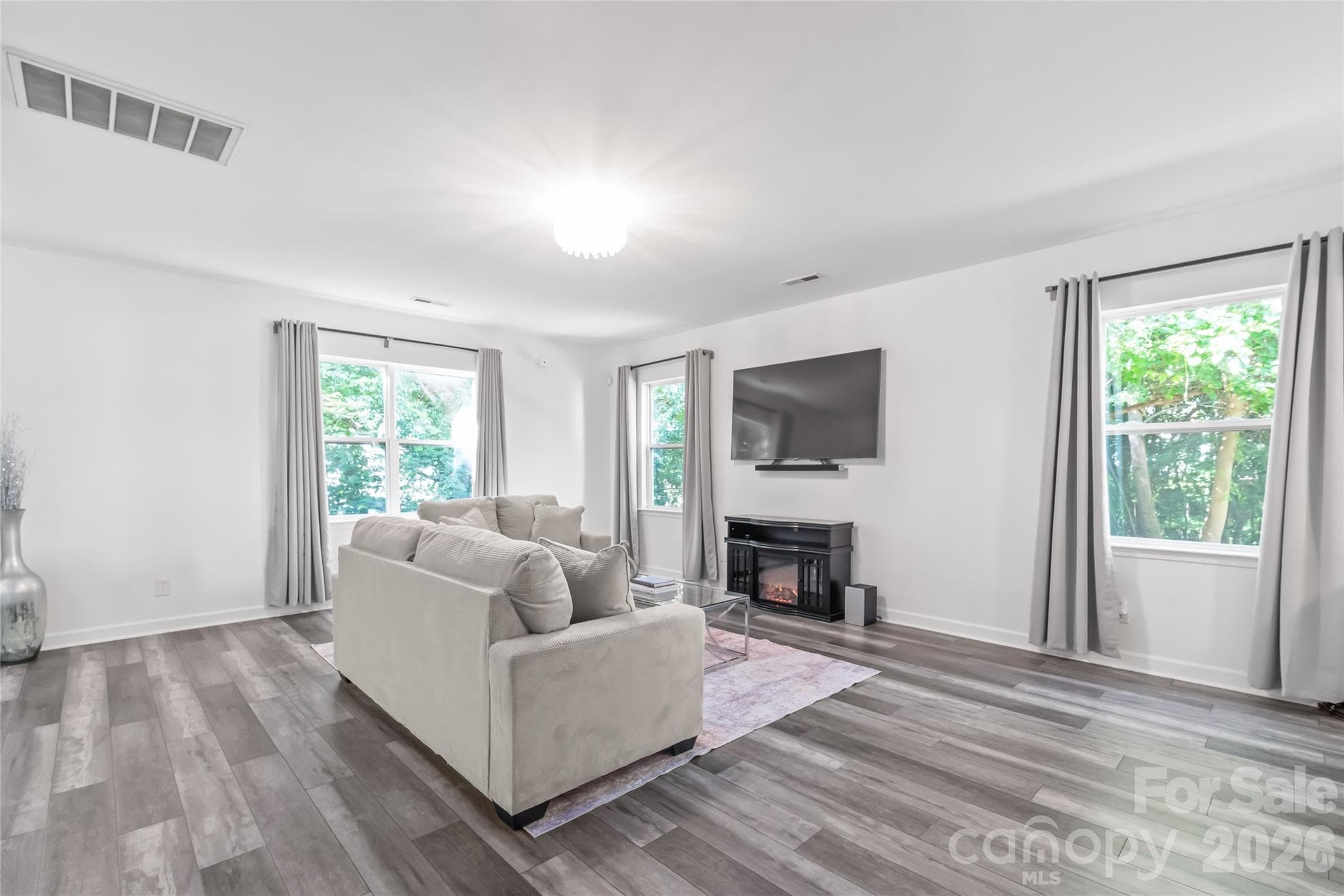 "View of the Great Room from the Dining Room." - 6404 Lanzerac Manor Drive, Charlotte