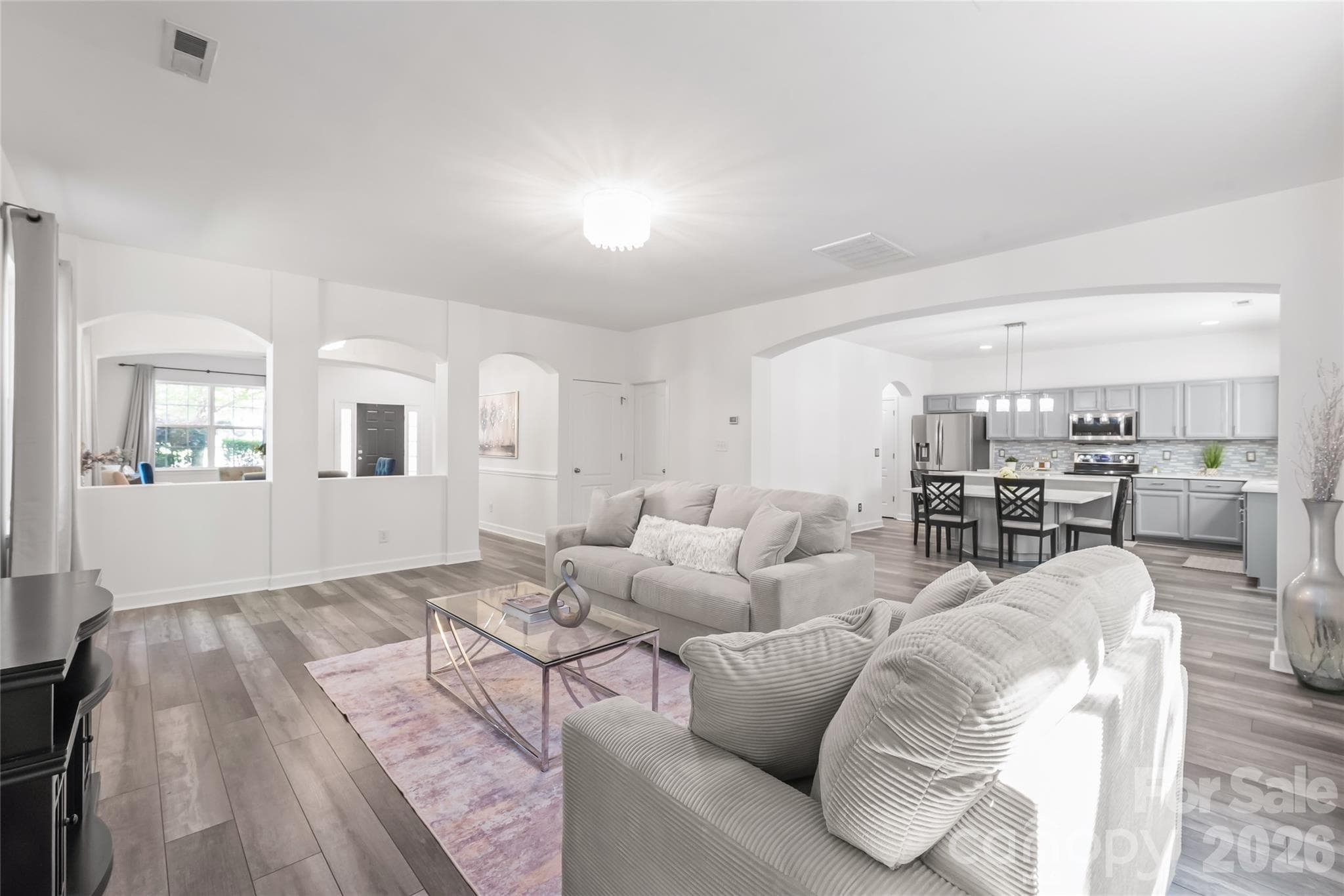 "The Great Room seamlessly flows into the Kitchen, creating an inviting and spacious atmosphere perfect for entertaining." - 6404 Lanzerac Manor Drive, Charlotte