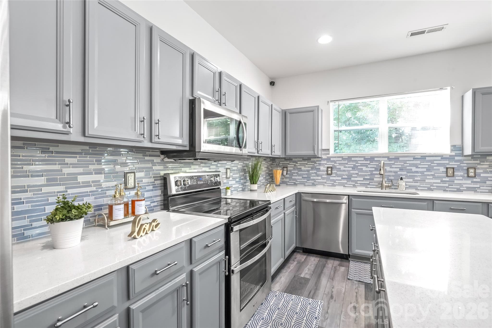 "The spacious kitchen provides ample counter space for cooking and food preparation." - 6404 Lanzerac Manor Drive, Charlotte