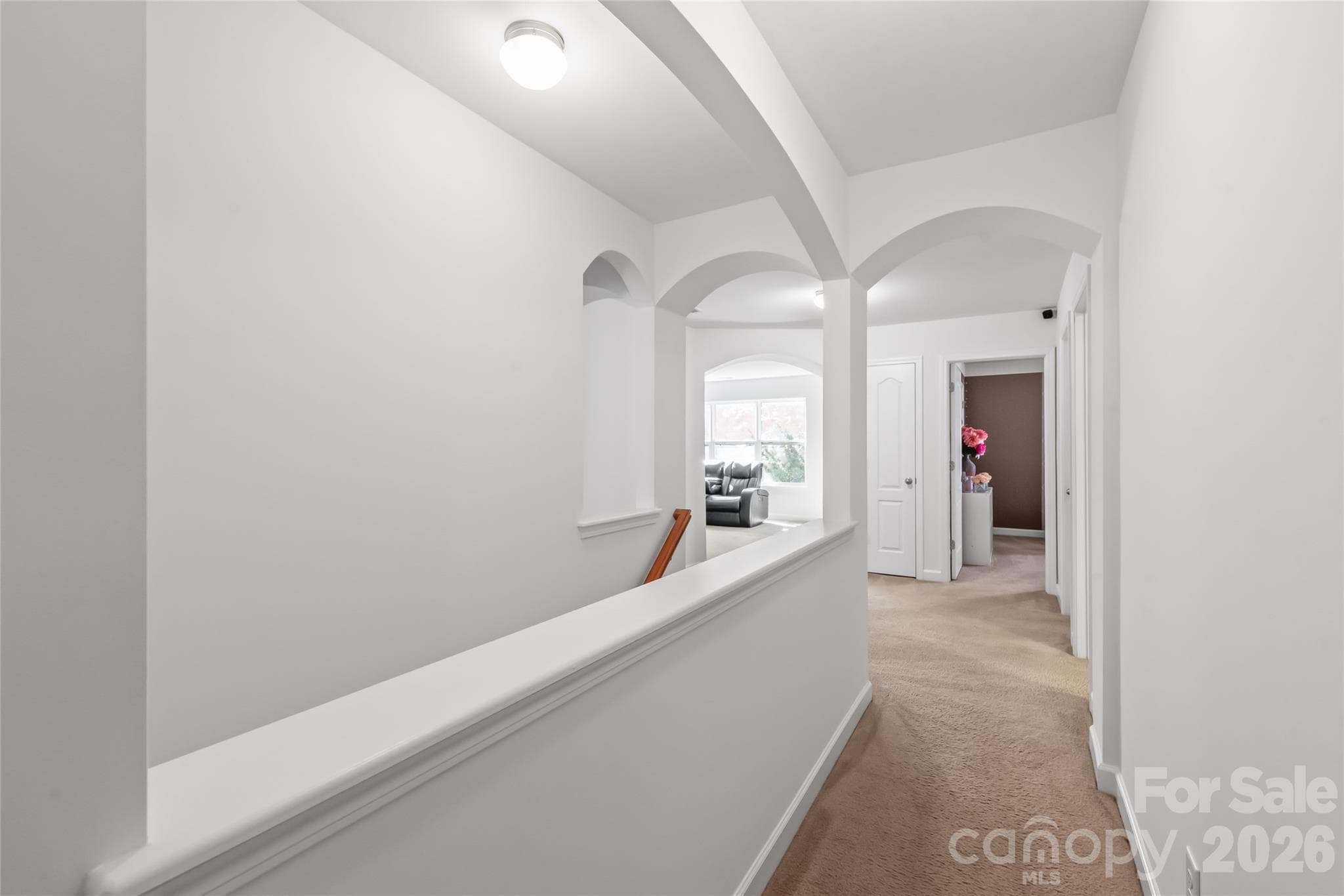 "The second-floor hallway features beautiful architectural details." - 6404 Lanzerac Manor Drive, Charlotte