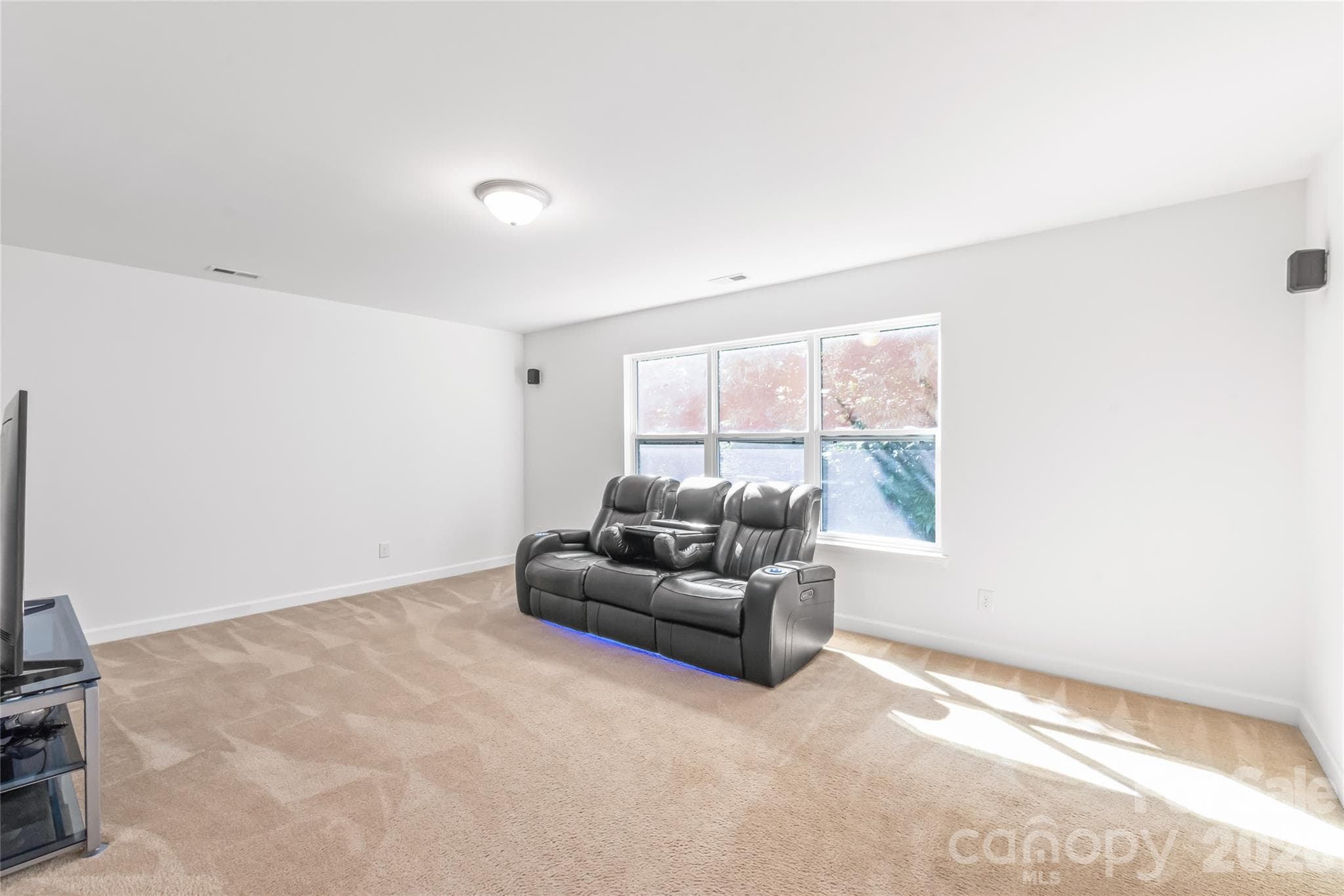 'Spacious second floor bonus room equipped with surround sound speakers." - 6404 Lanzerac Manor Drive, Charlotte