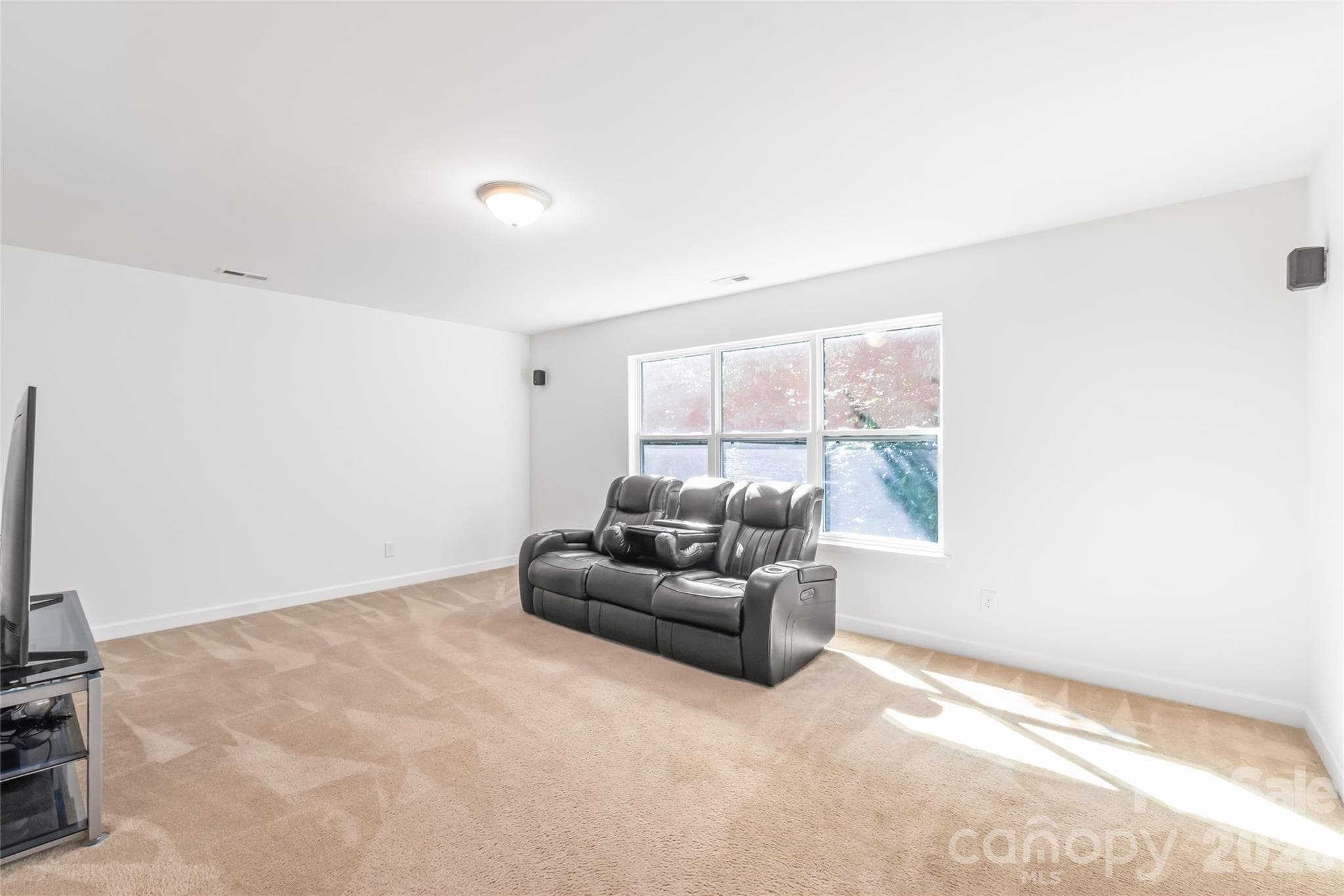 "A generous bonus room on the second floor, perfect for unforgettable movie nights, exciting gaming sessions, or cozy family gatherings." - 6404 Lanzerac Manor Drive, Charlotte