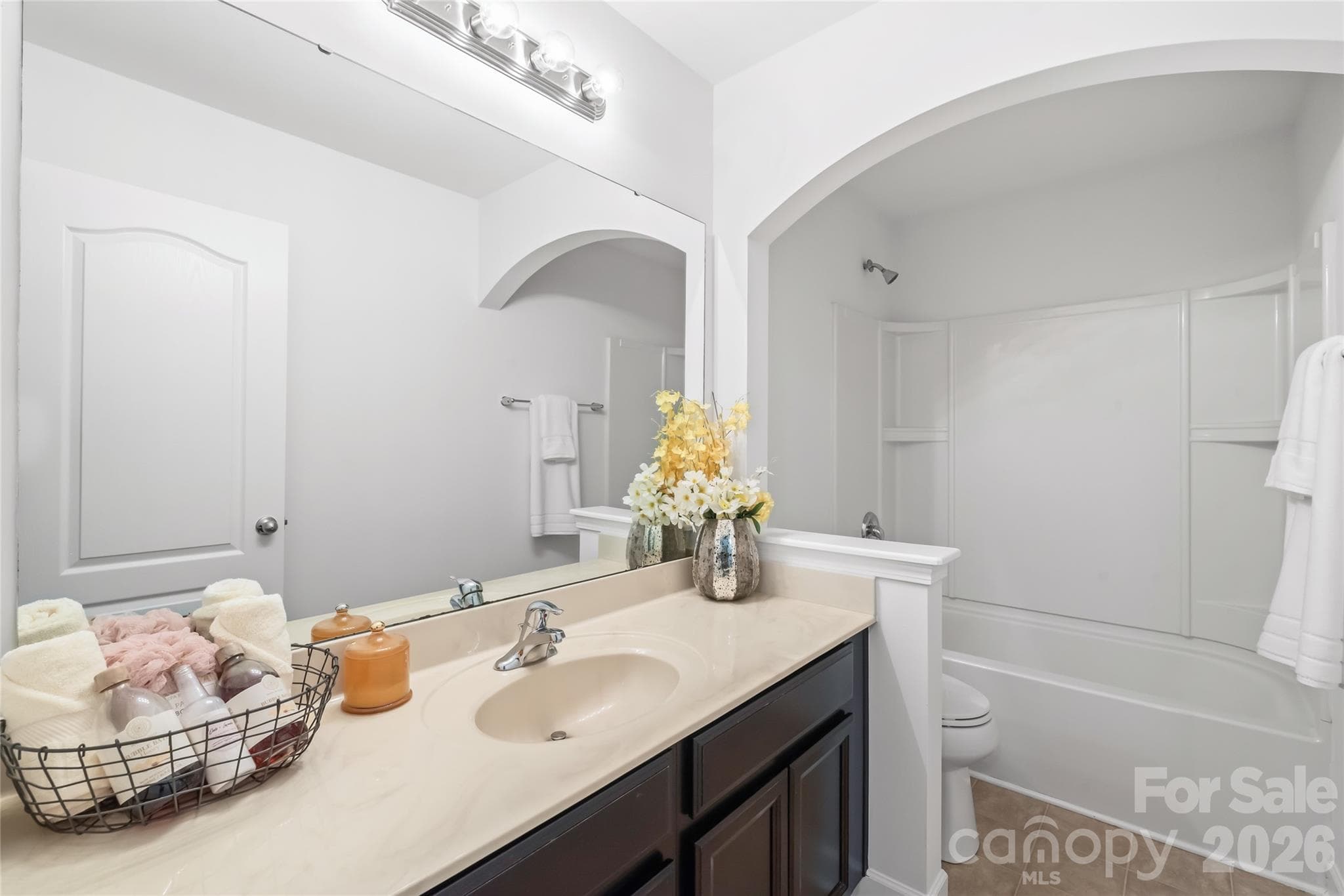 "Discover the spacious second floor guest bathroom, featuring ample counter space for all your needs." - 6404 Lanzerac Manor Drive, Charlotte