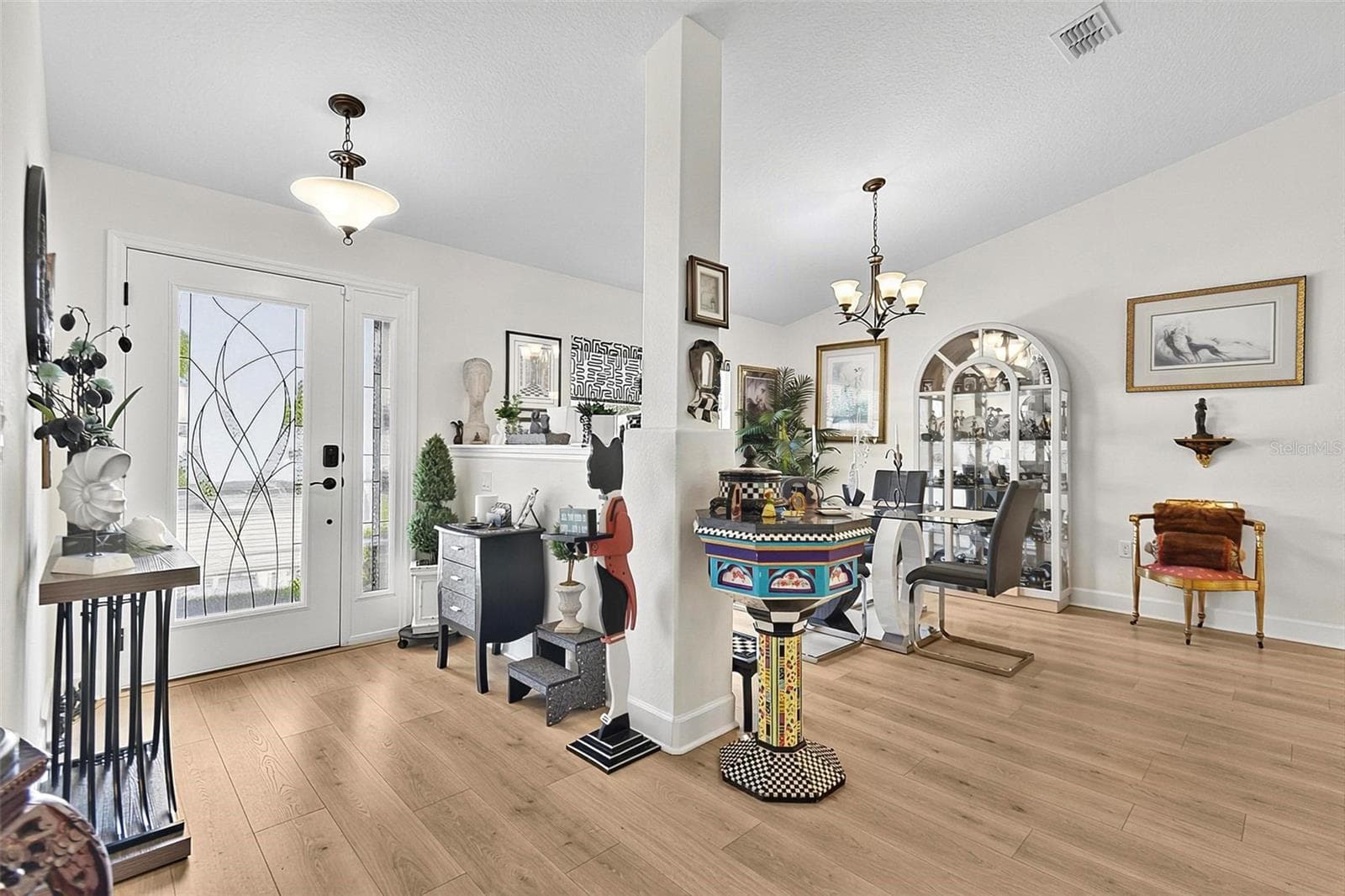 Decorative full light front door and side light - 21 WOOD CLIFT LN, PALM COAST