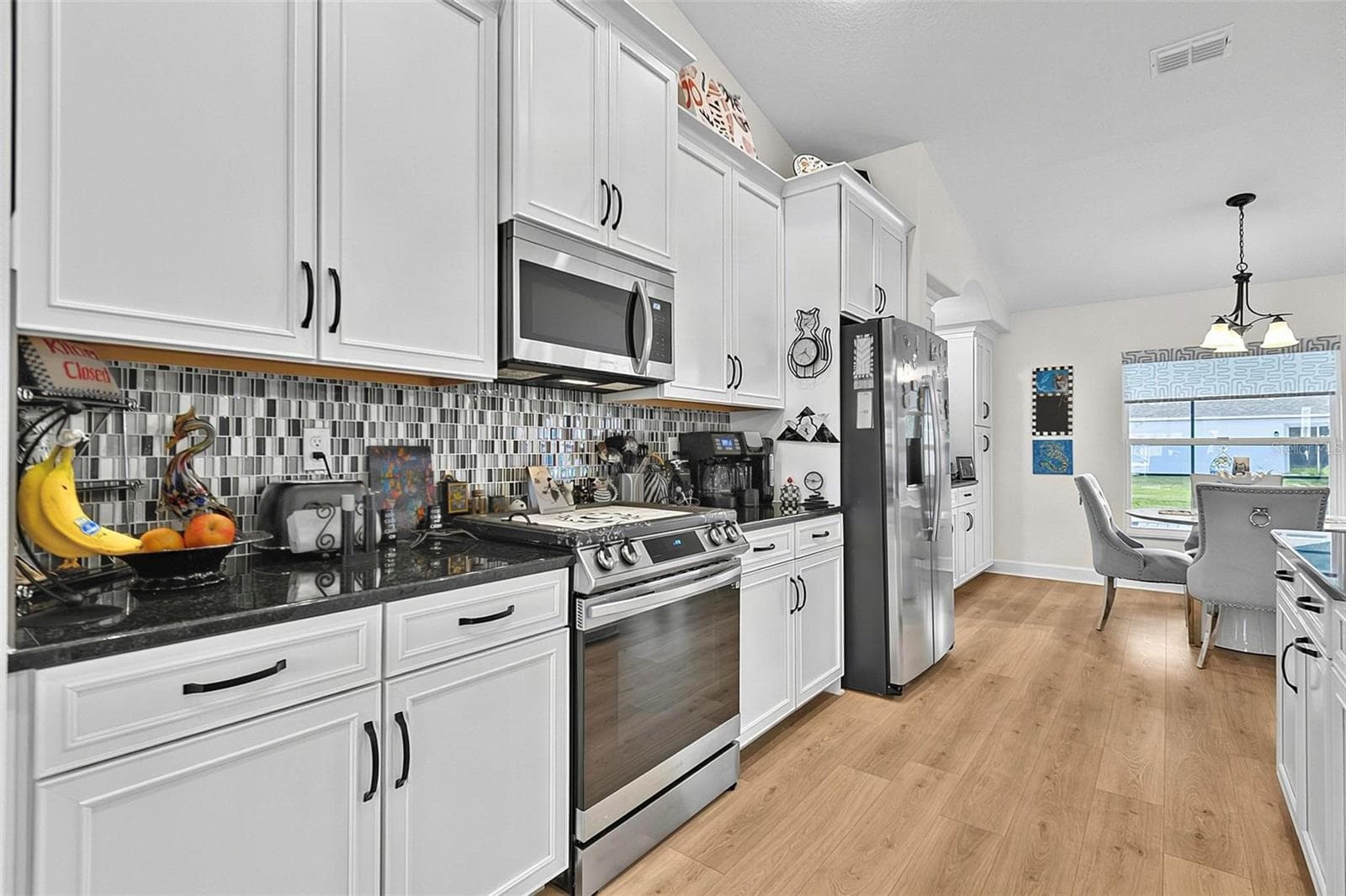 Soft close cabinets with Glass tile backsplash - 21 WOOD CLIFT LN, PALM COAST
