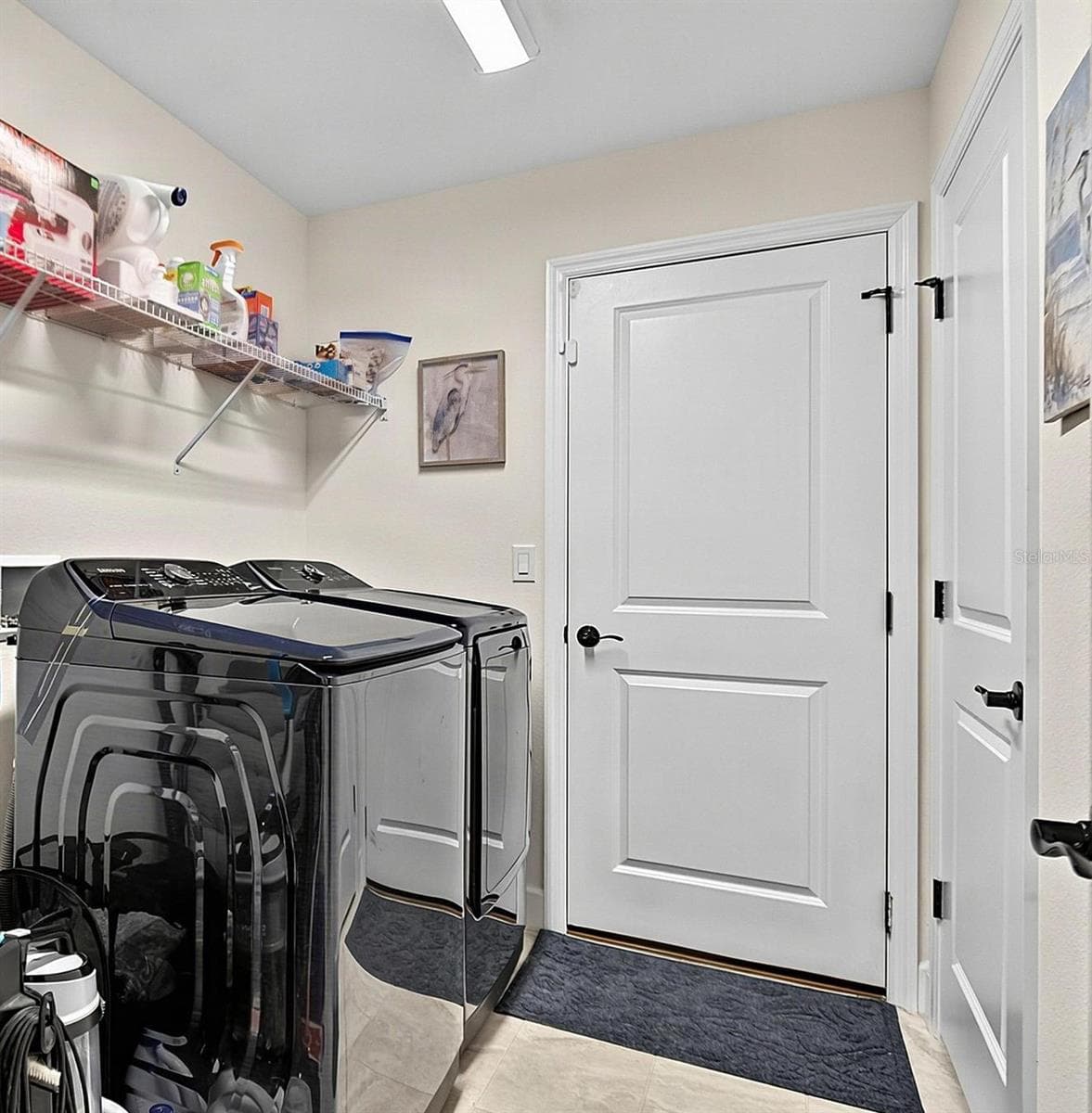 Laundry room with shelving - 21 WOOD CLIFT LN, PALM COAST