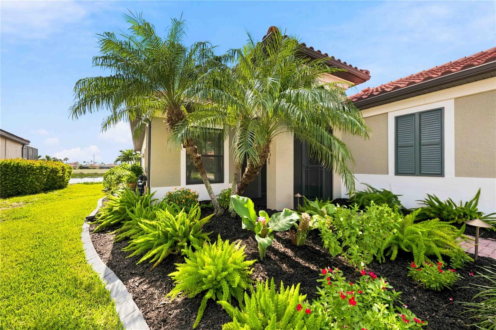 The Landscaping and curbing on this home is superb. - 23709 WAVERLY CIR, VENICE