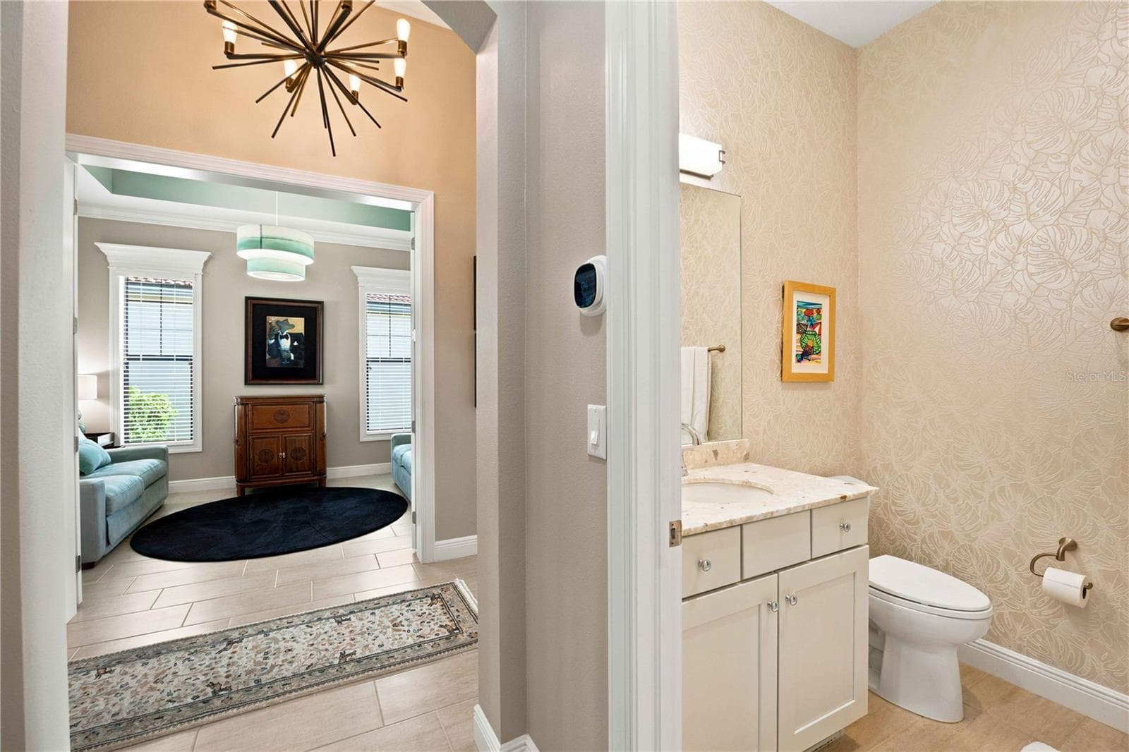 There is a full bath off the front entry - easy for guests and easy for the two bedrooms in this area of the home. - 23709 WAVERLY CIR, VENICE